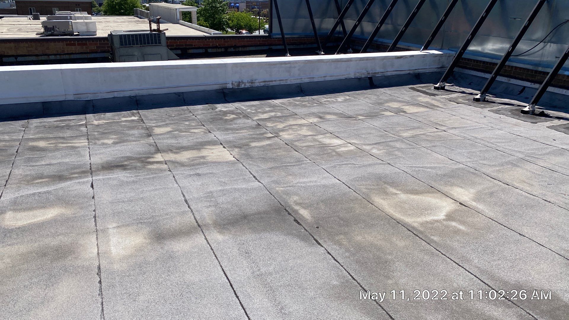 Commercial Roof Coating using Fiberseal basecoat and Silicon Topcoat by Just In Time Roofing and Restoration