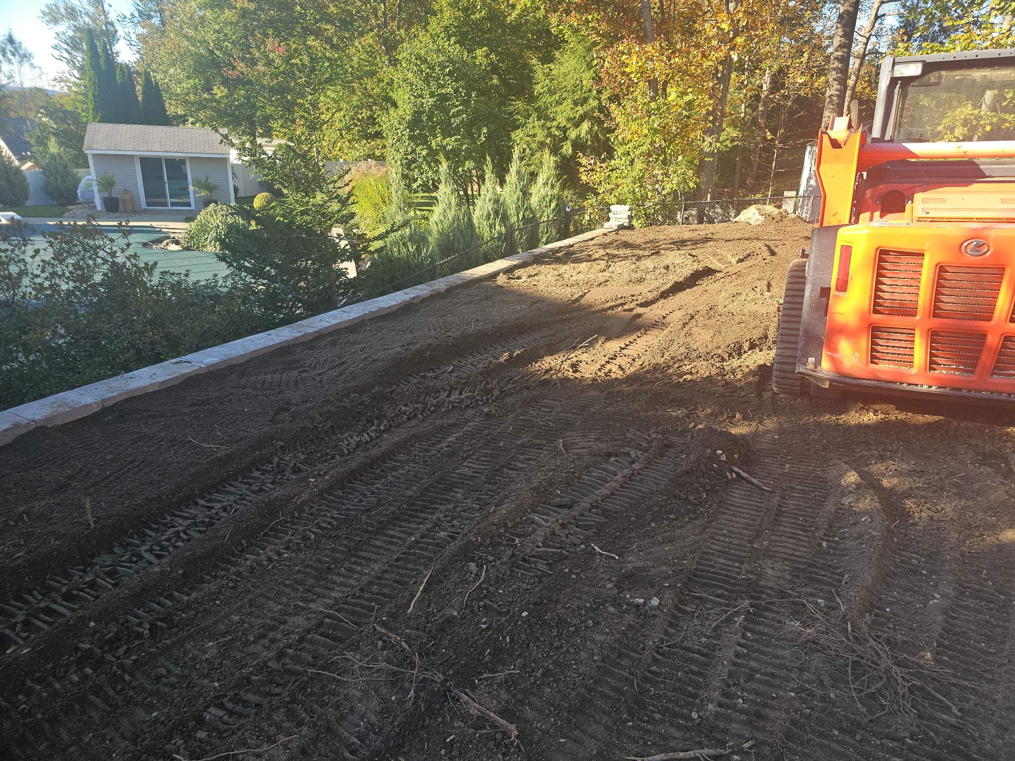 Retaining Wall to Level Backyard  by May Property Management 