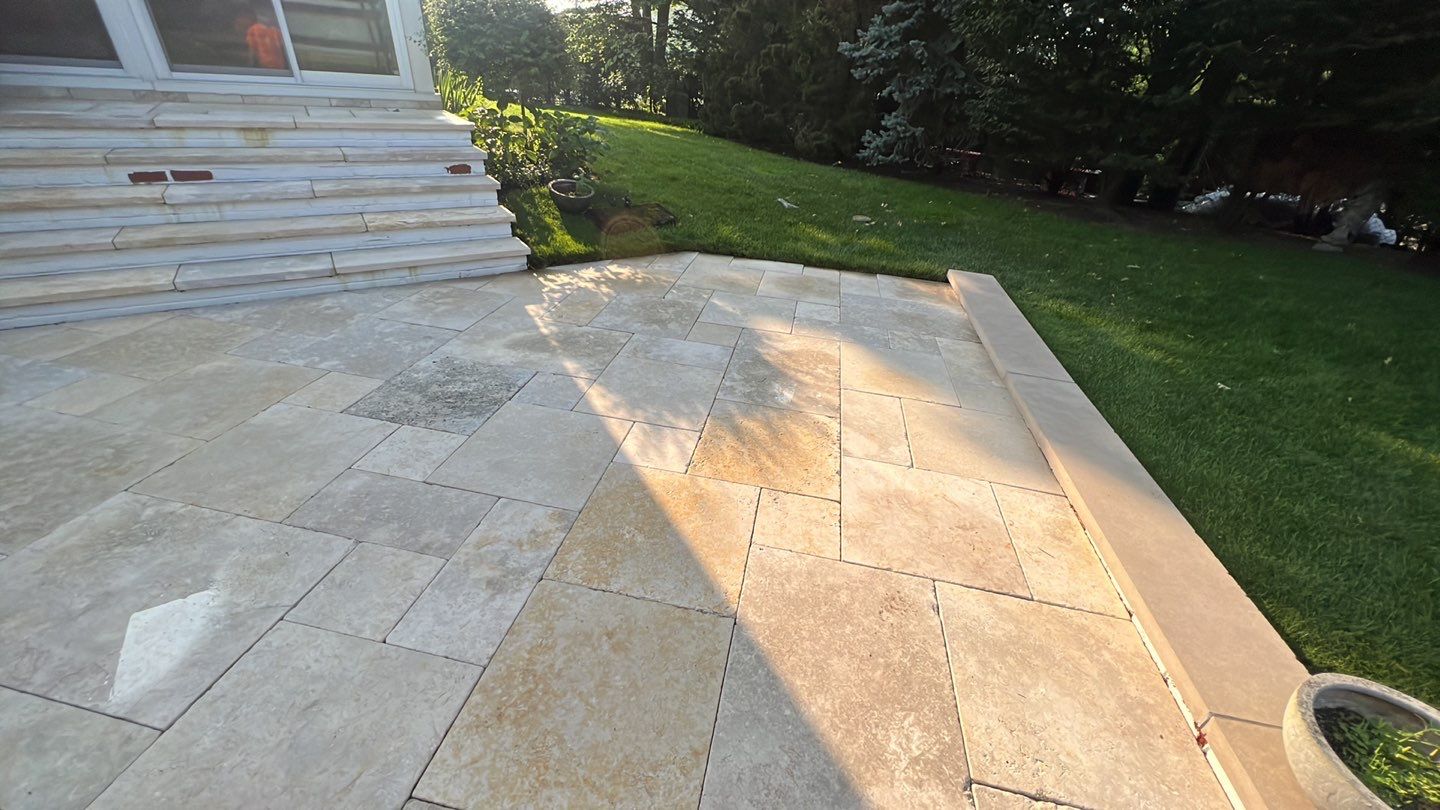 marble patio cleaning and sanding using Polysweep polymeric sand by Northern Power Washing LLC.