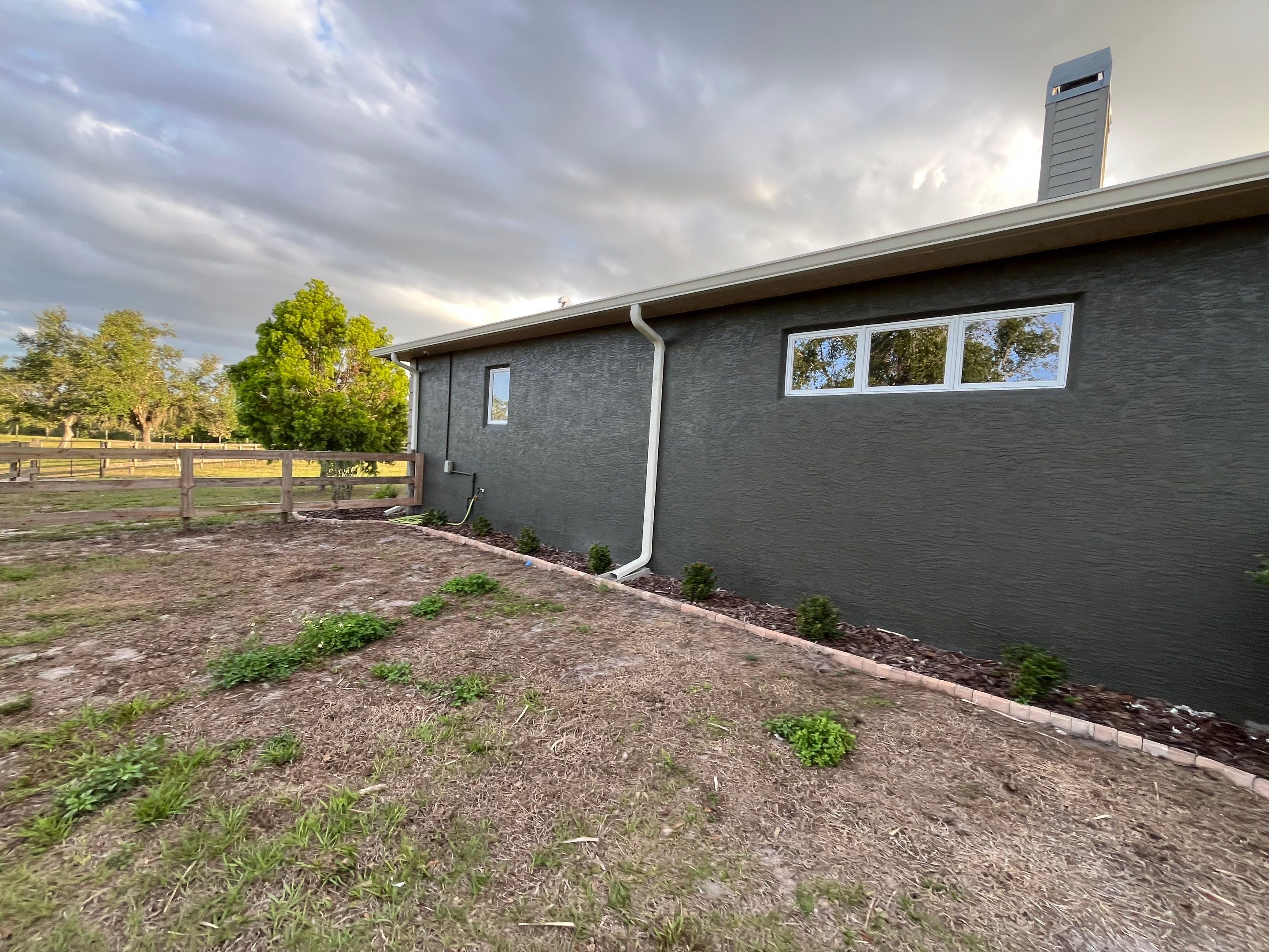  7-inch White seamless gutters and downspouts in Myakka City FL by Gutter Professors