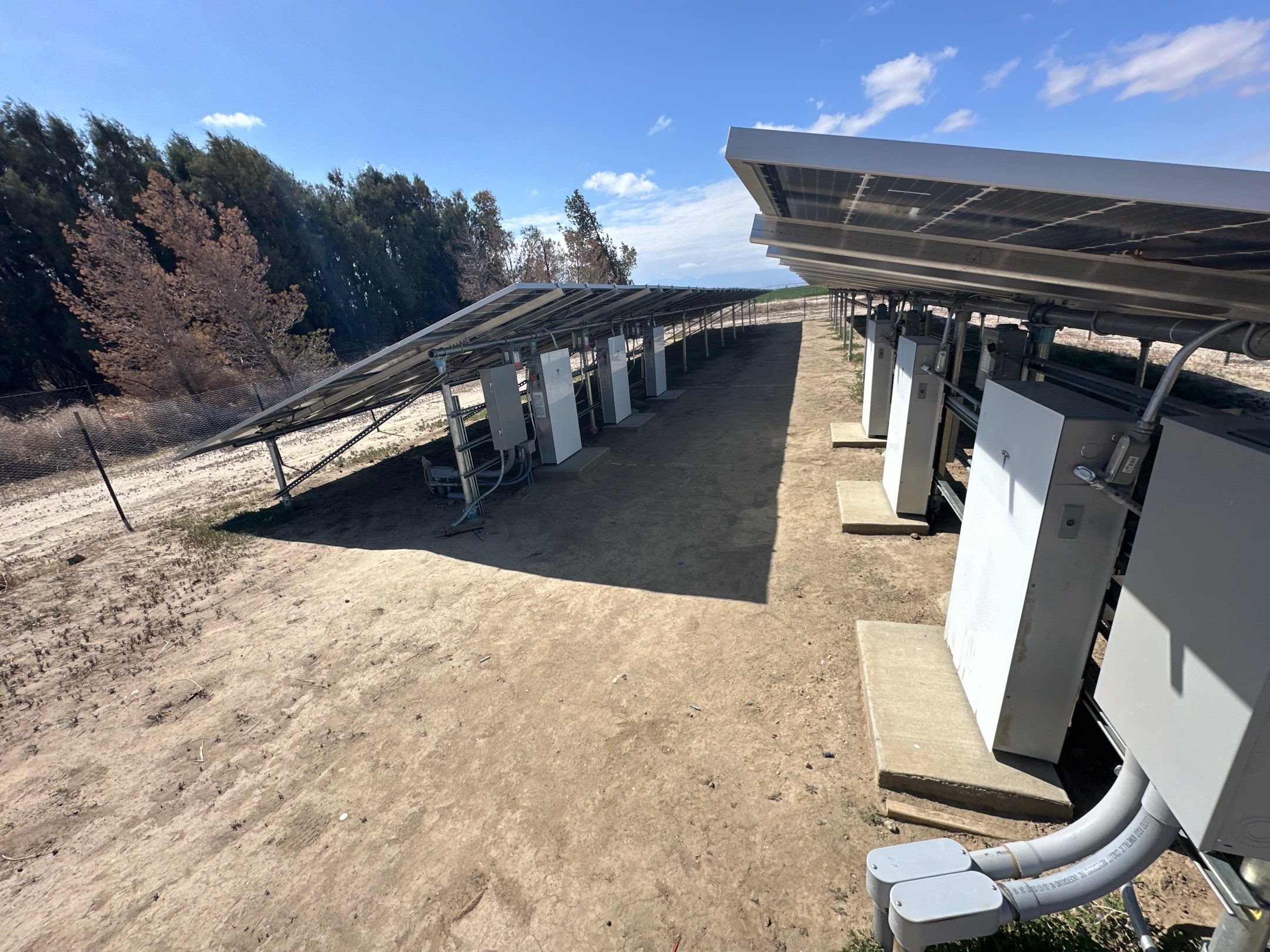 Large-Scale Ground-Mount Solar and Tesla Powerwall Battery Installation by AWS Solar