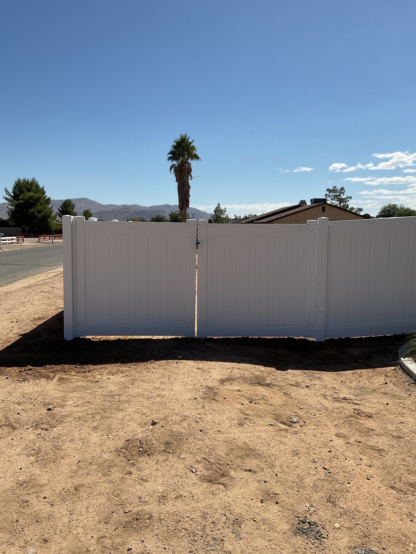 6ft White Privacy Vinyl Fence with Chain-link Fence by Fence Guys Inc.