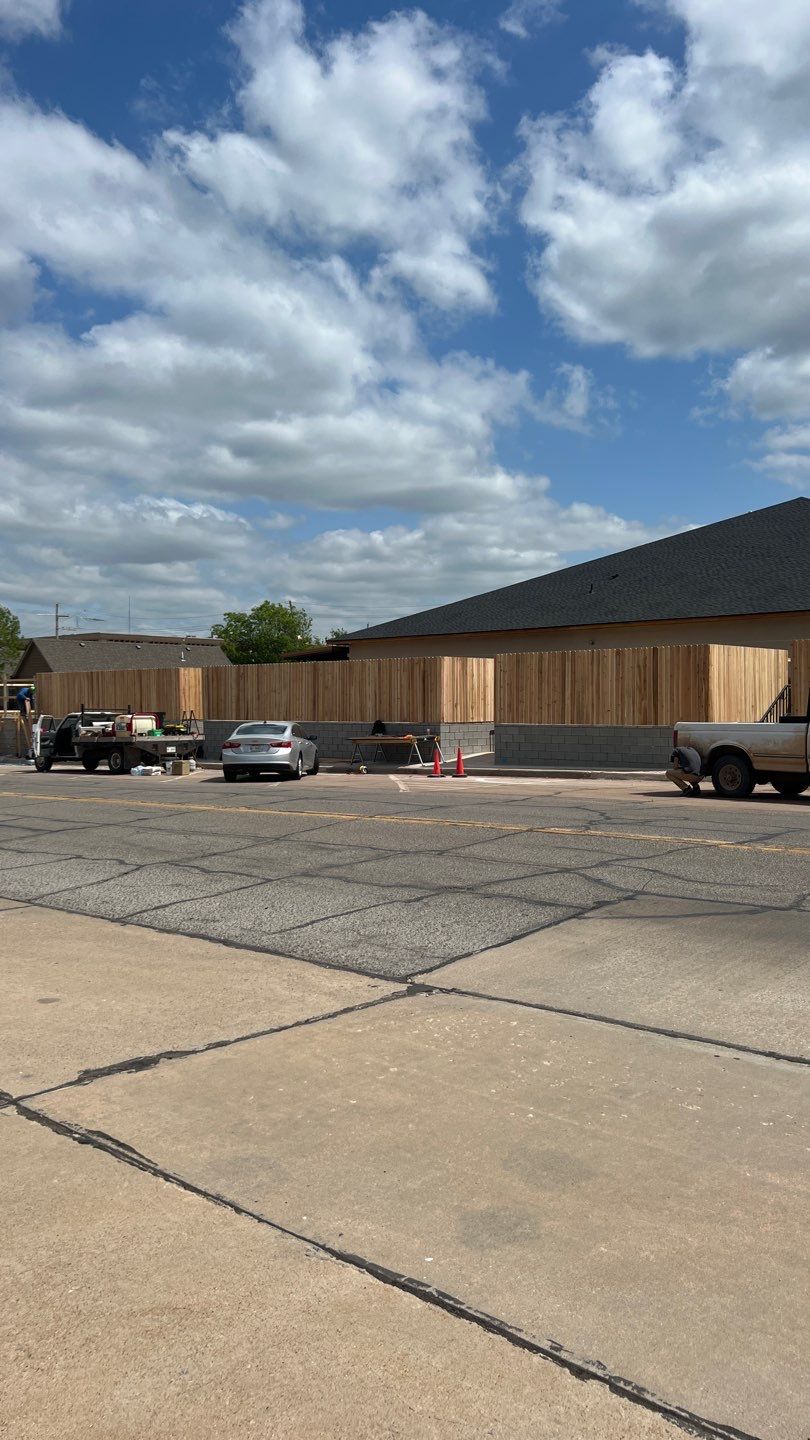 Cedar Fence using Cedar Pickets and Metal Poles by Clays Services Inc