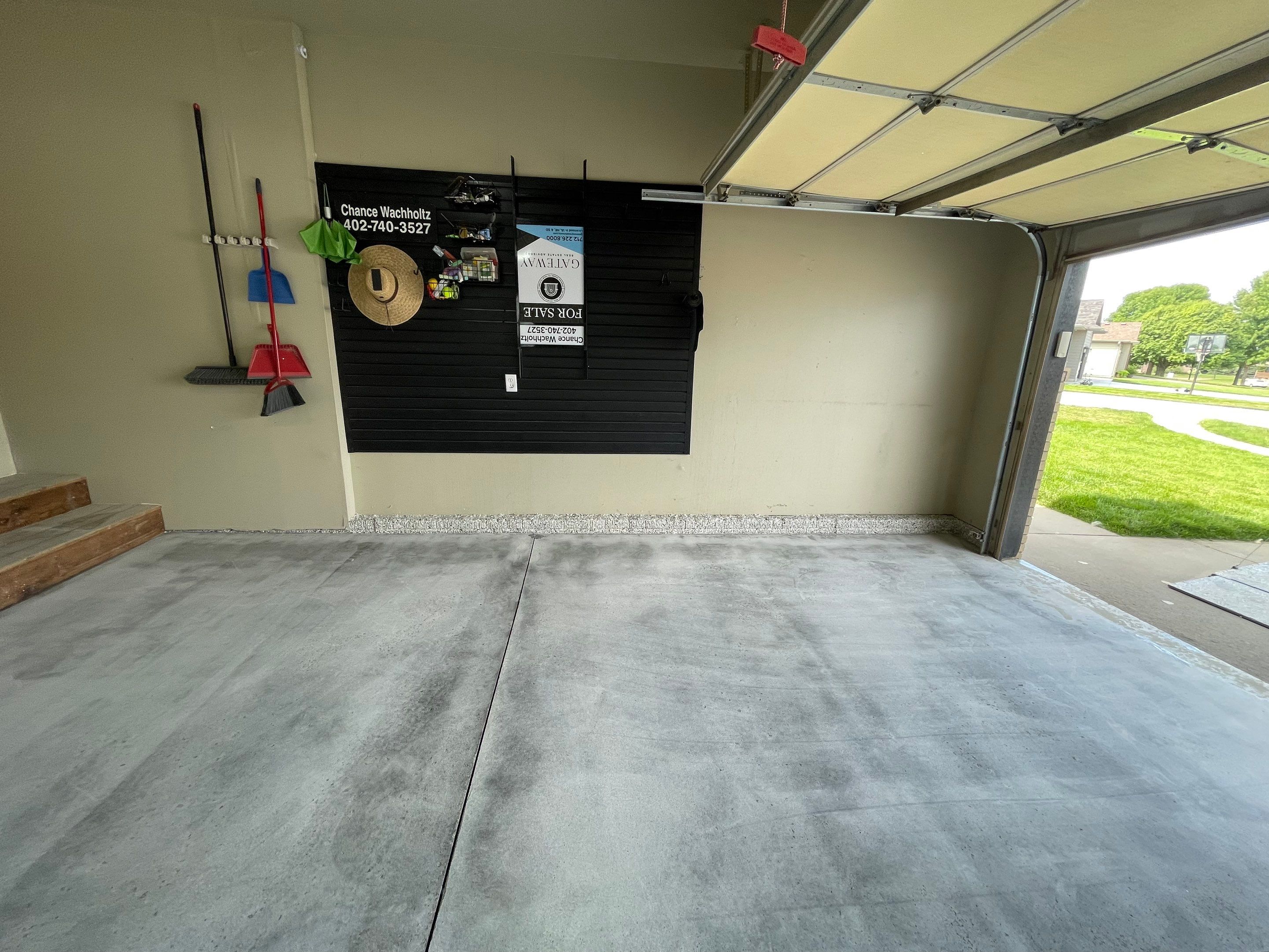 Cabin FEver Flake Garage Floor Coating Installation in Sioux Falls by Select Painting, Coatings & Garage Cabinets