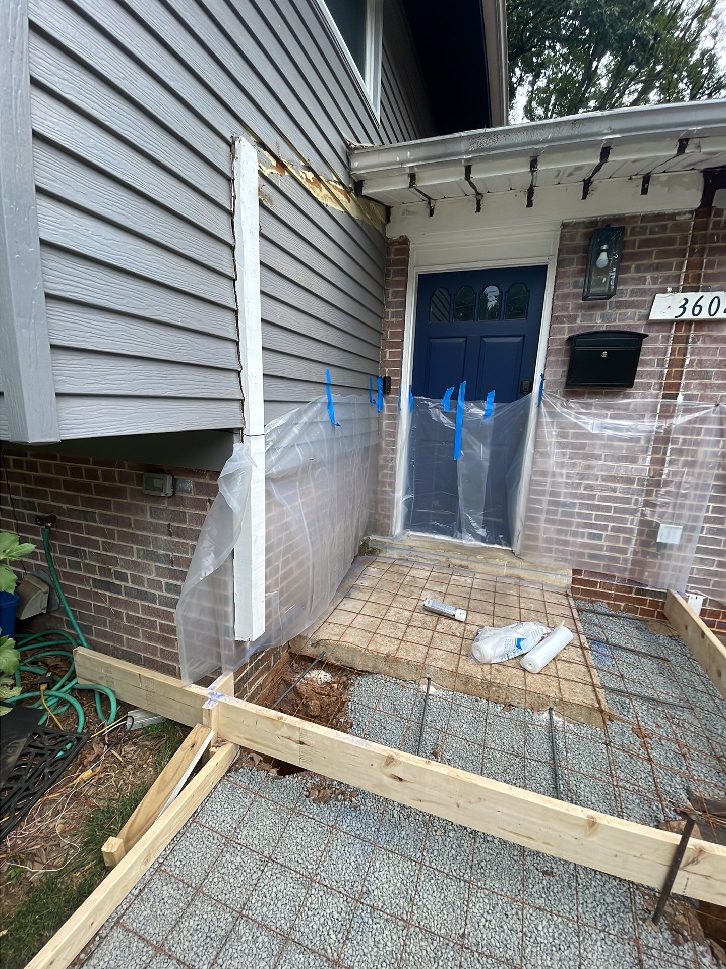 New walkway with stairs and a new front porch by Fairfax Contractors, LLC