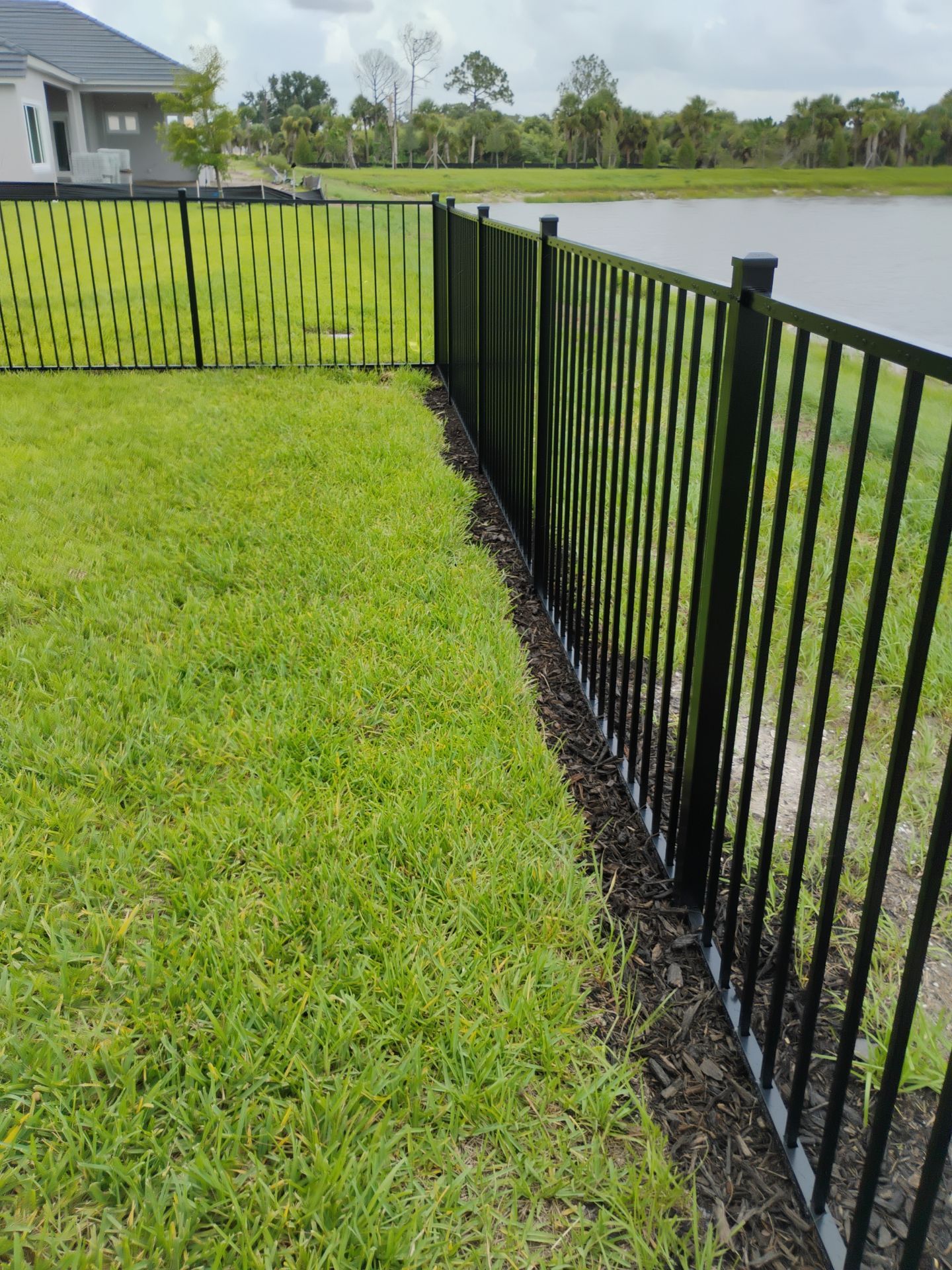 Black Aluminum Picket Fence Installation in Venice, Florida by True Fence LLC
