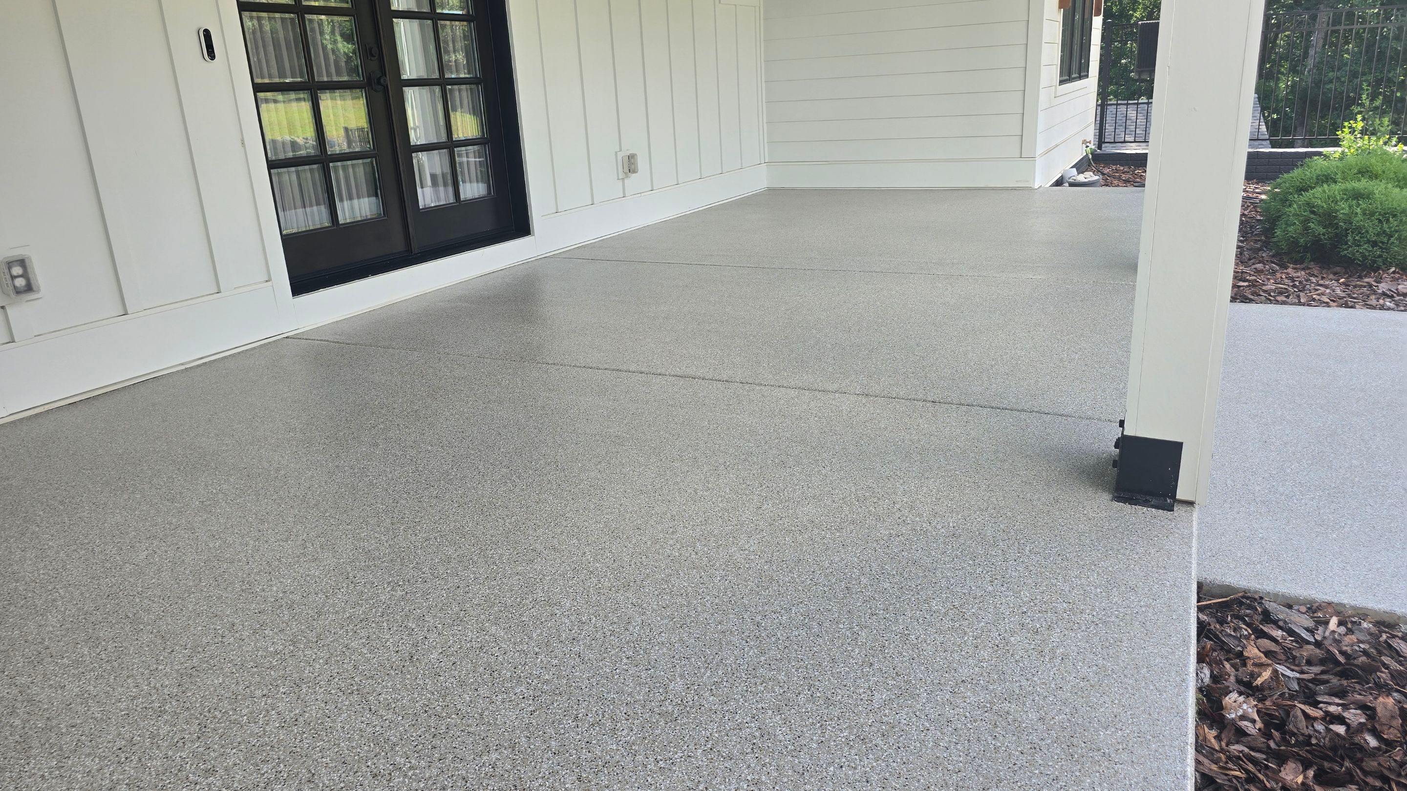 Front Porch & Garage Using Creekbed by Elite Floor Solutions