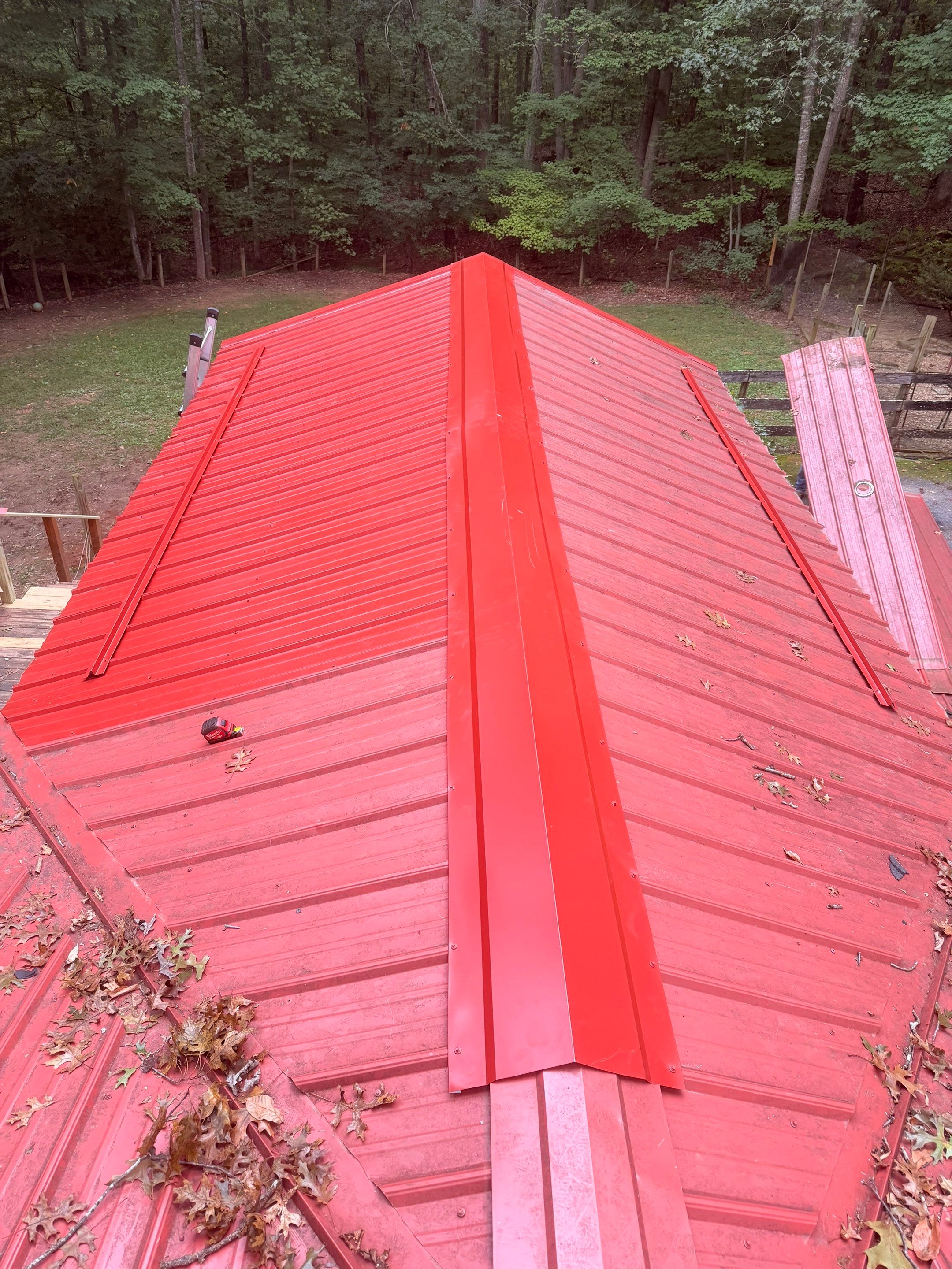 Red Metal Roof Restoration and Wood Fascia Replacement in Barboursville by Cade Construction