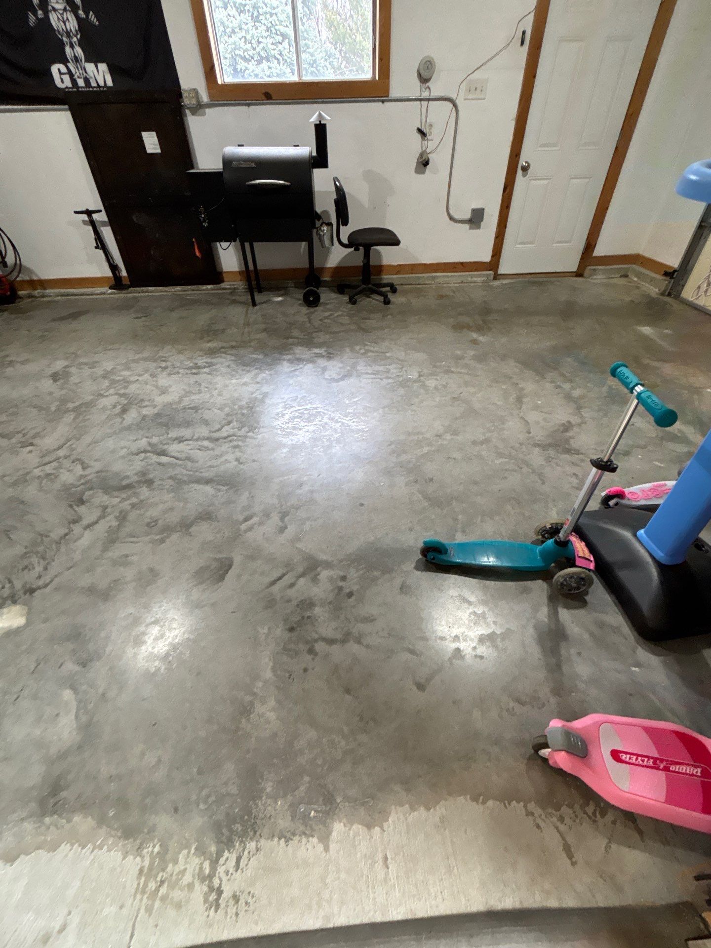 Gray and Black Speckled Polyurea Garage Floor in Dell Rapids by Select Painting, Coatings & Garage Cabinets