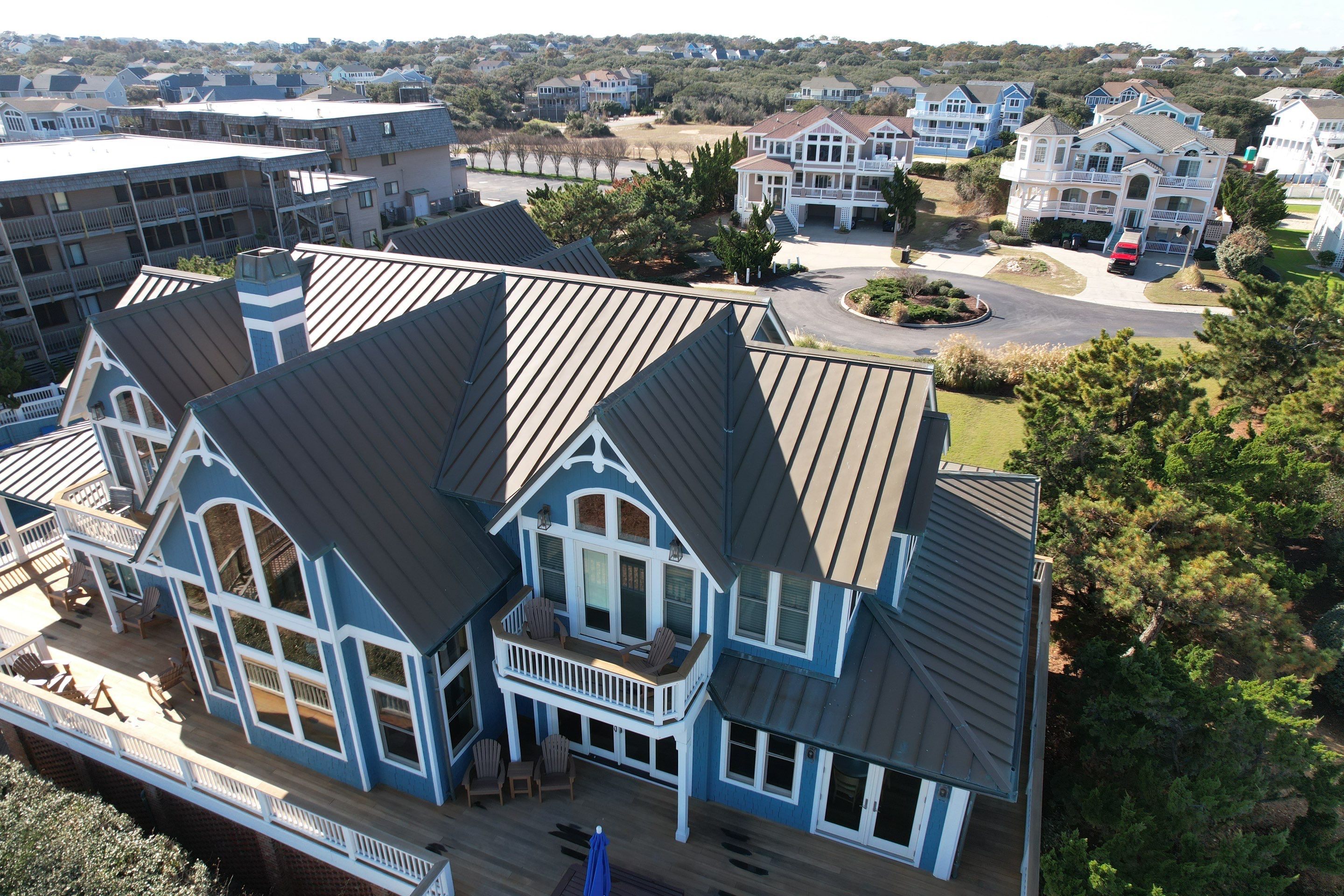 Large Metal Roof Transformation by Gallop Roofing & Remodeling, Inc.