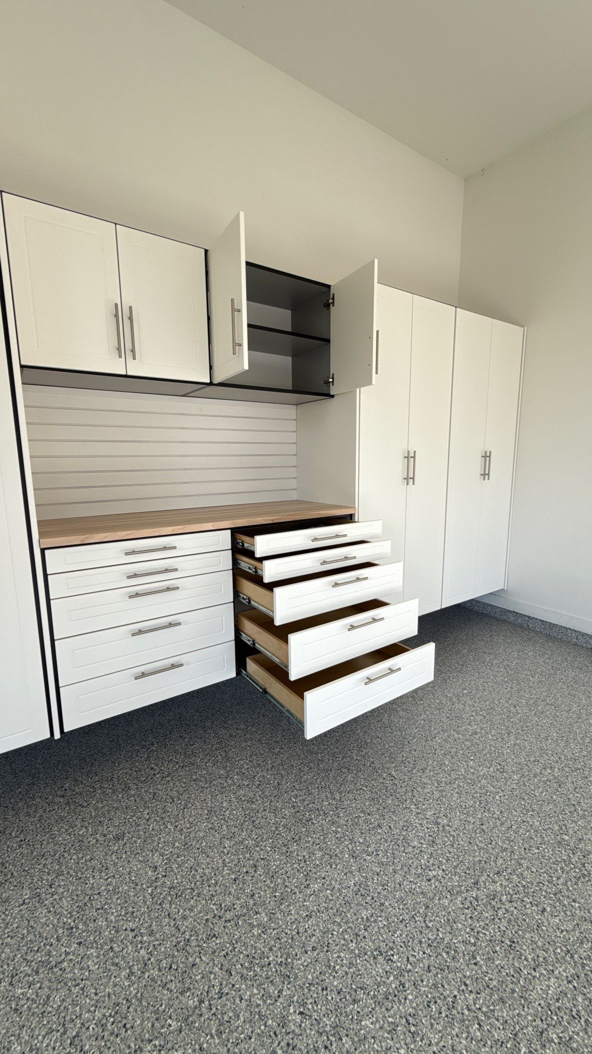 Garage Remodel with Custom Cabinets and Epoxy Floors in Overland Park by Banner Garage