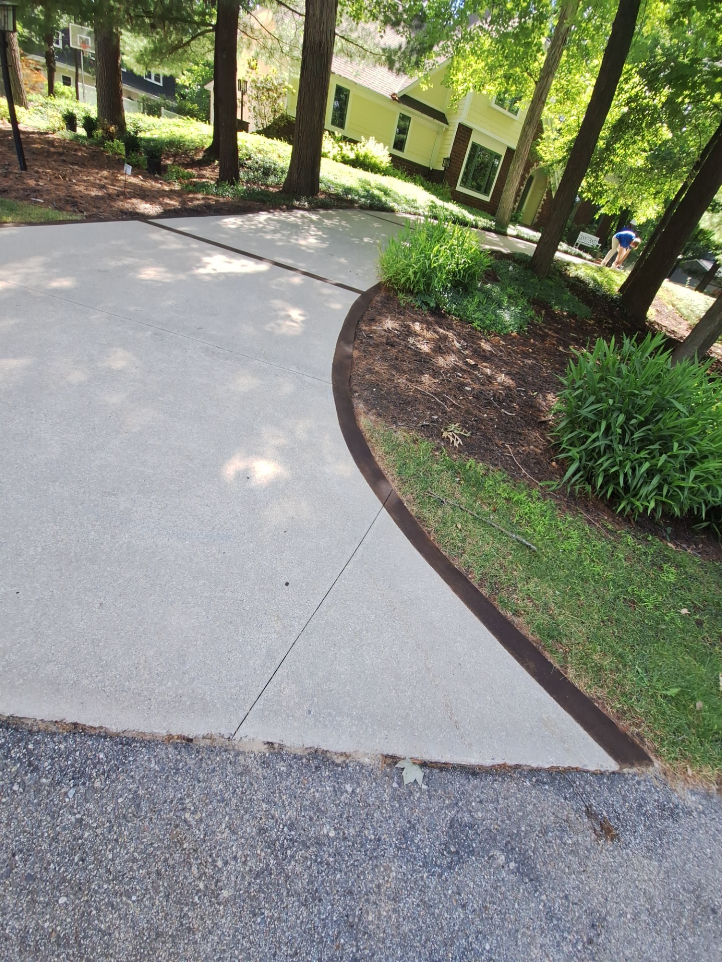 Concrete Driveway and Walkway Staining With Espresso Borders in Grand Rapids by Gordon Painting
