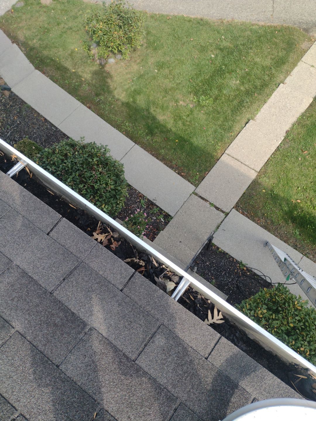 Commercial gutter cleaning Flint, MI before photo with filled gutters