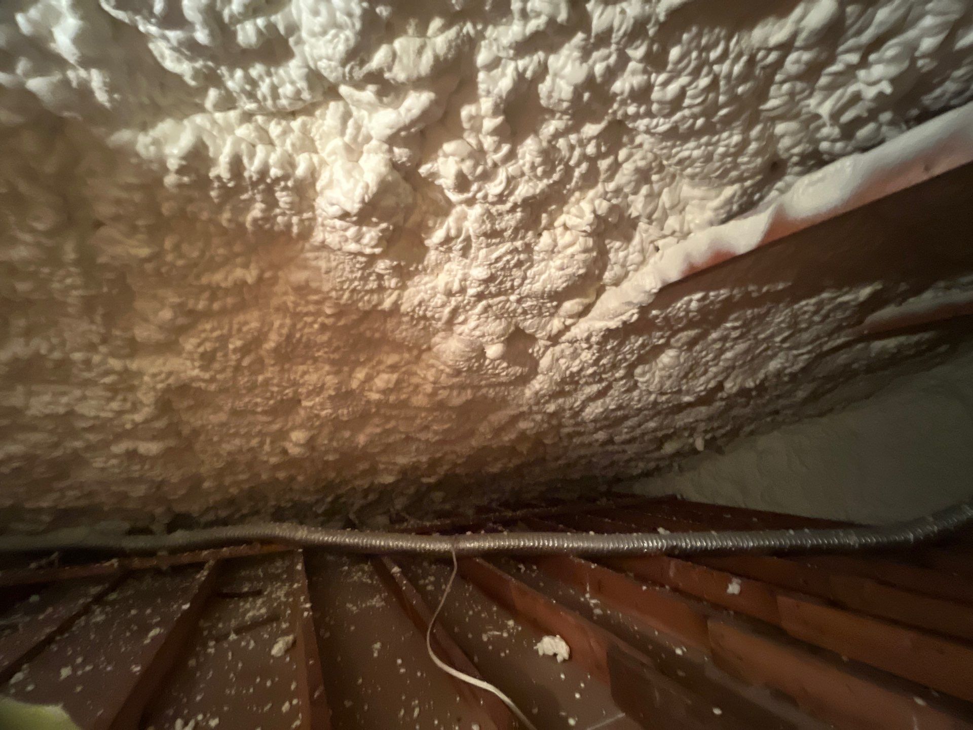 Garage ceiling using open cell spray foam by NYS Foam & Energy