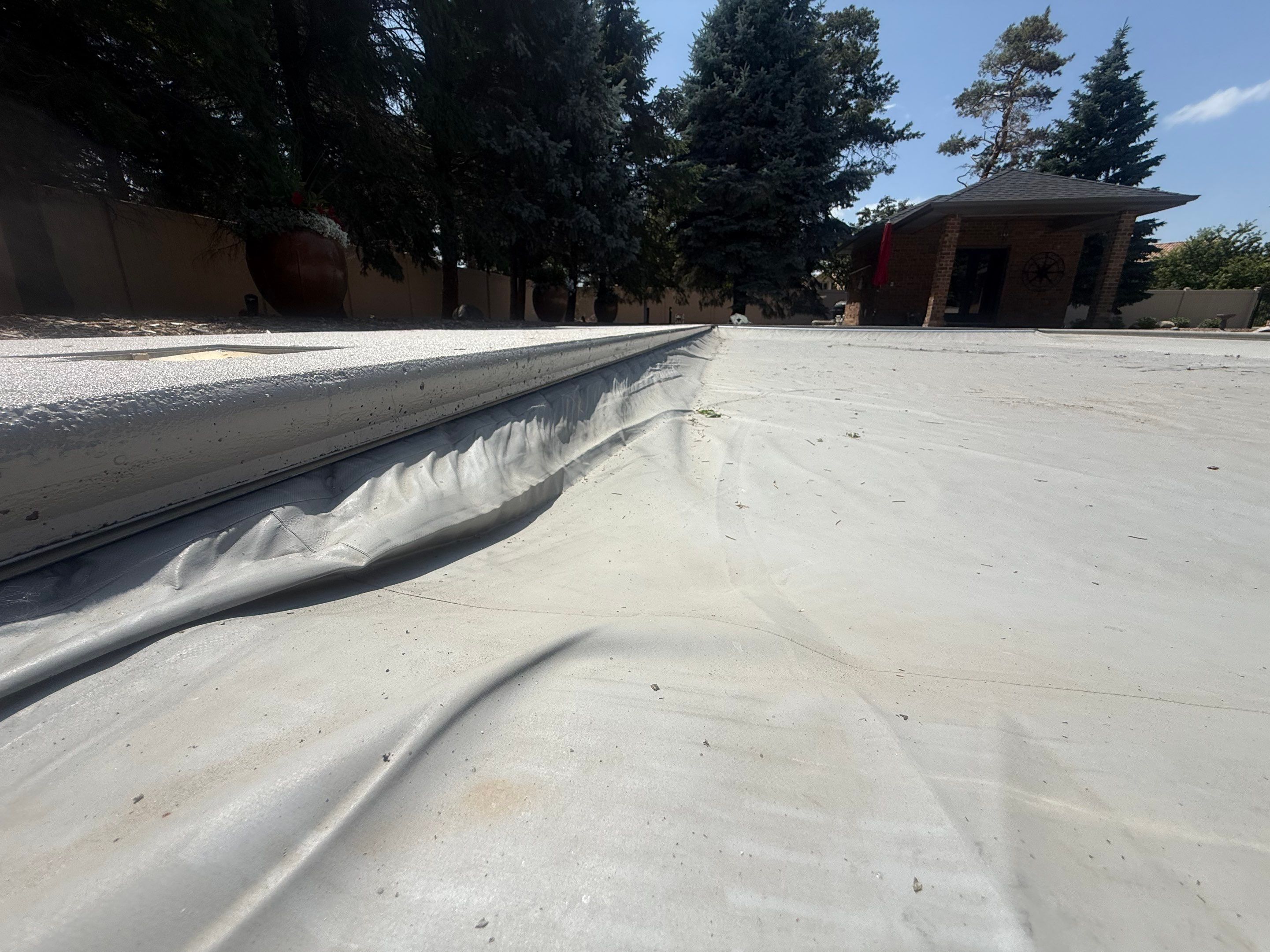 Decorative Concrete Pool Deck and Patio Resurfacing in Sioux Falls by Select Painting, Coatings & Garage Cabinets