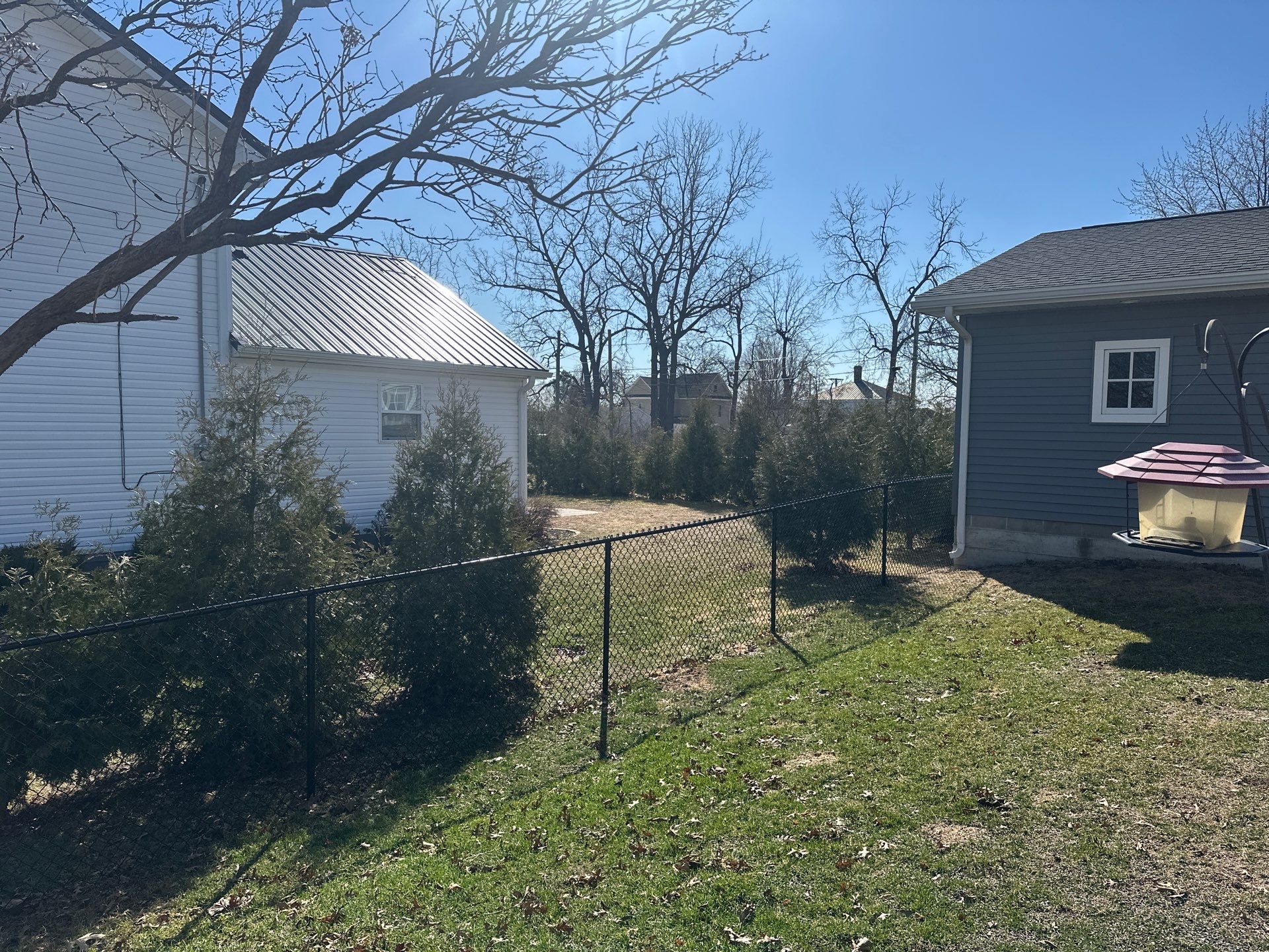 Black Chain Link Backyard Fence Installation in Independence by Perfect Picket Fence and Stain