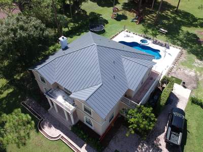 Residential Roofing Installation using 1" Nail strip metal roof