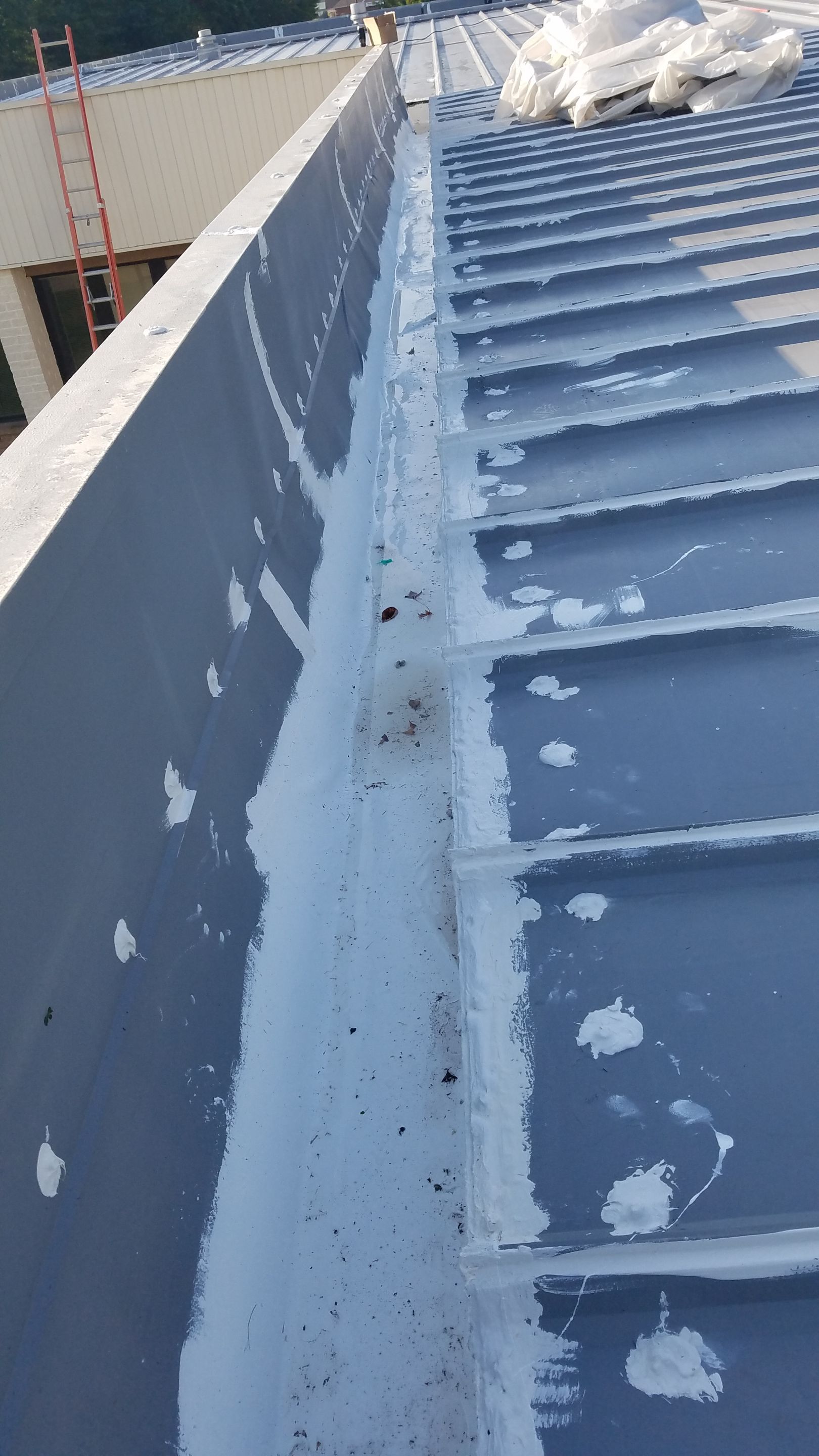 Commercial Metal Roof Coating by Gold Star Roofing LLC