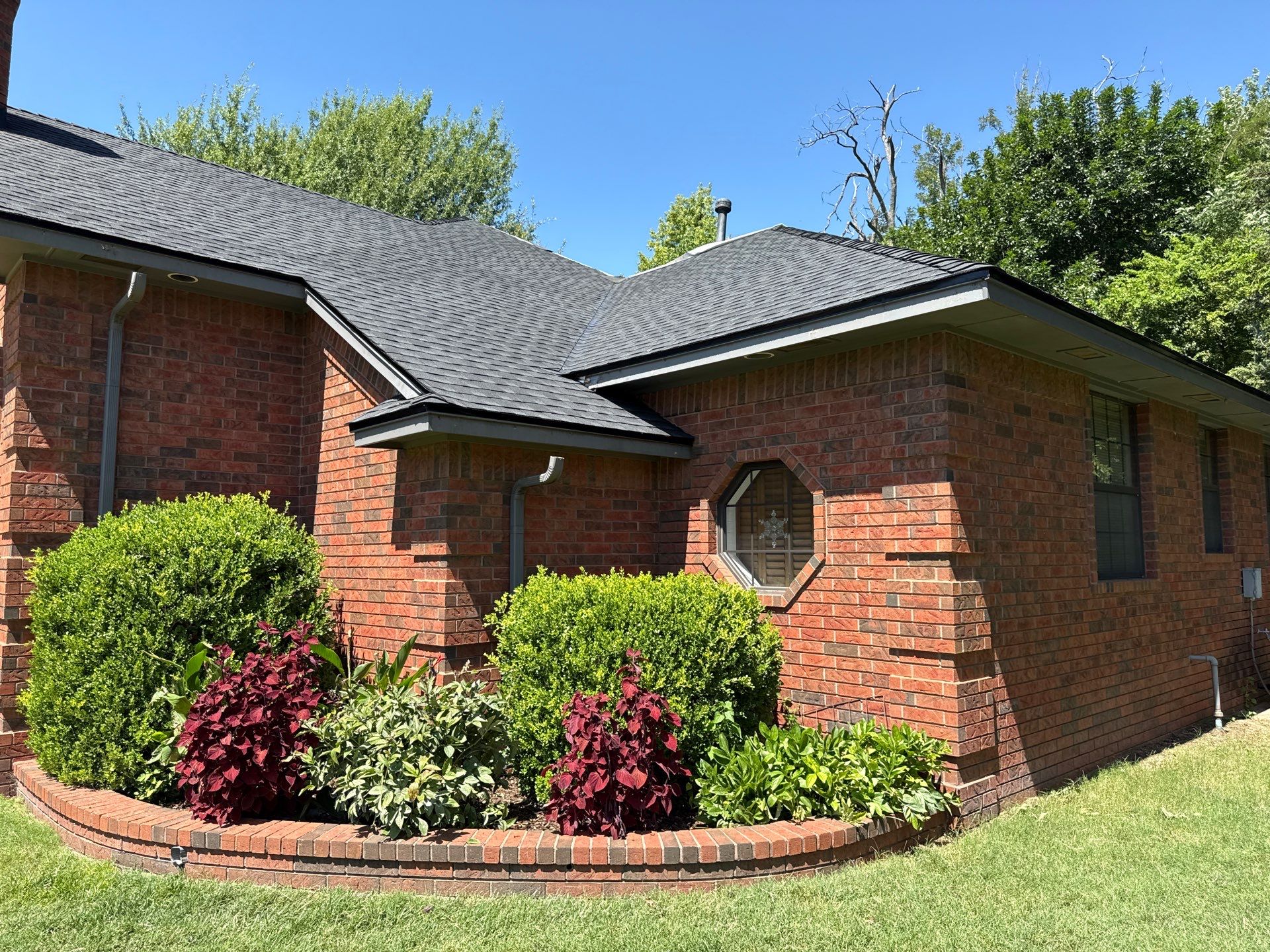 roof, skylight, and full vent system replacement in Mustang by McCann's Roofing and Construction