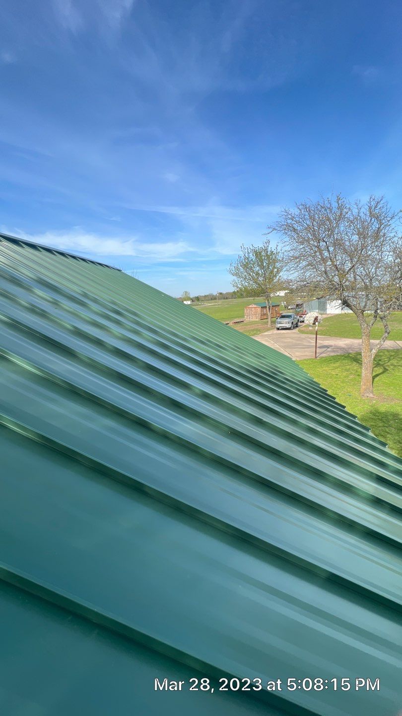 Shingle to Standing Seam Metal Roof by Springtree Restoration 