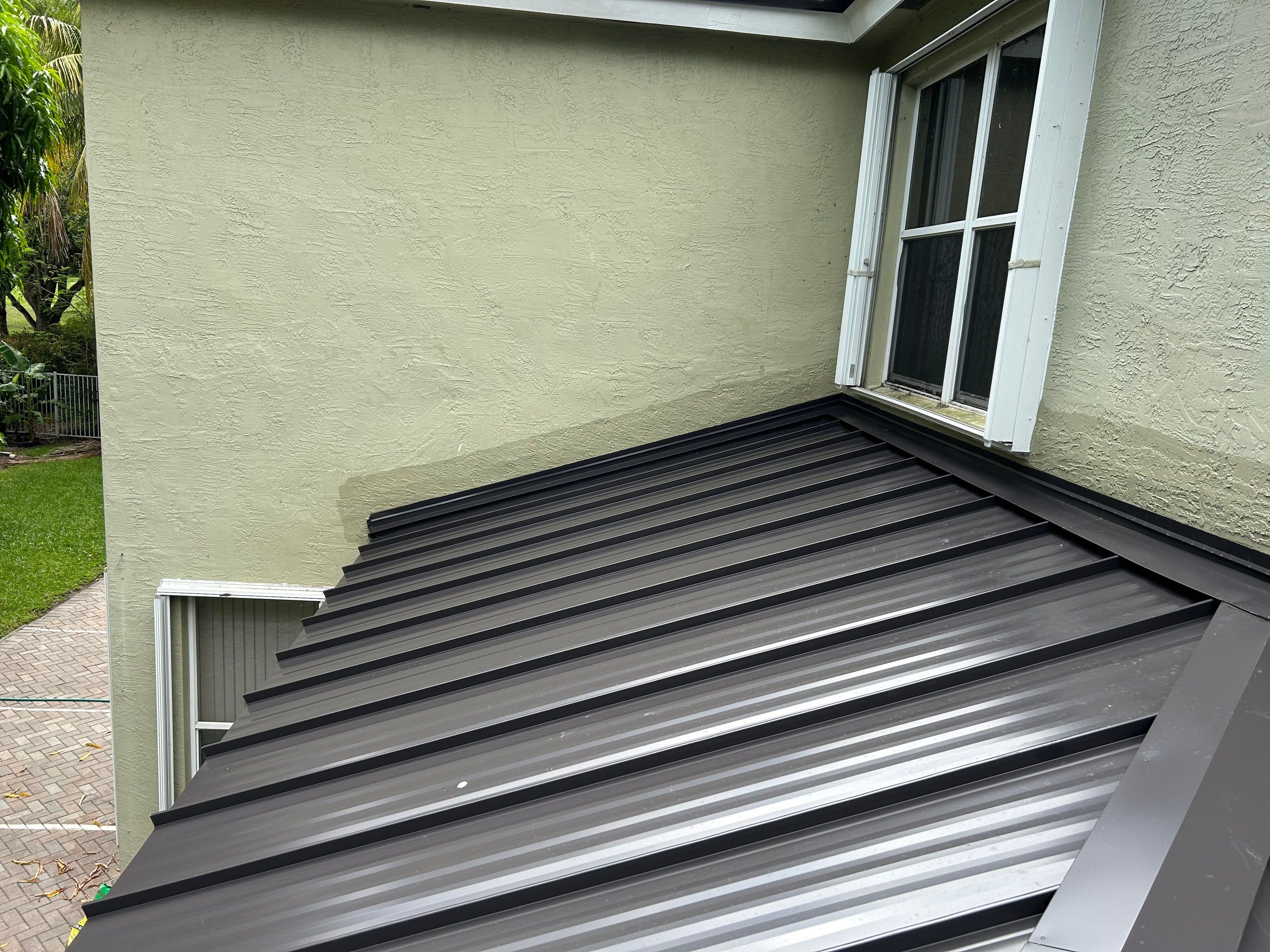 24ga 1.5" Mechanical Seam Dark Bronze by Total Roofing System The Metal Roof Experts