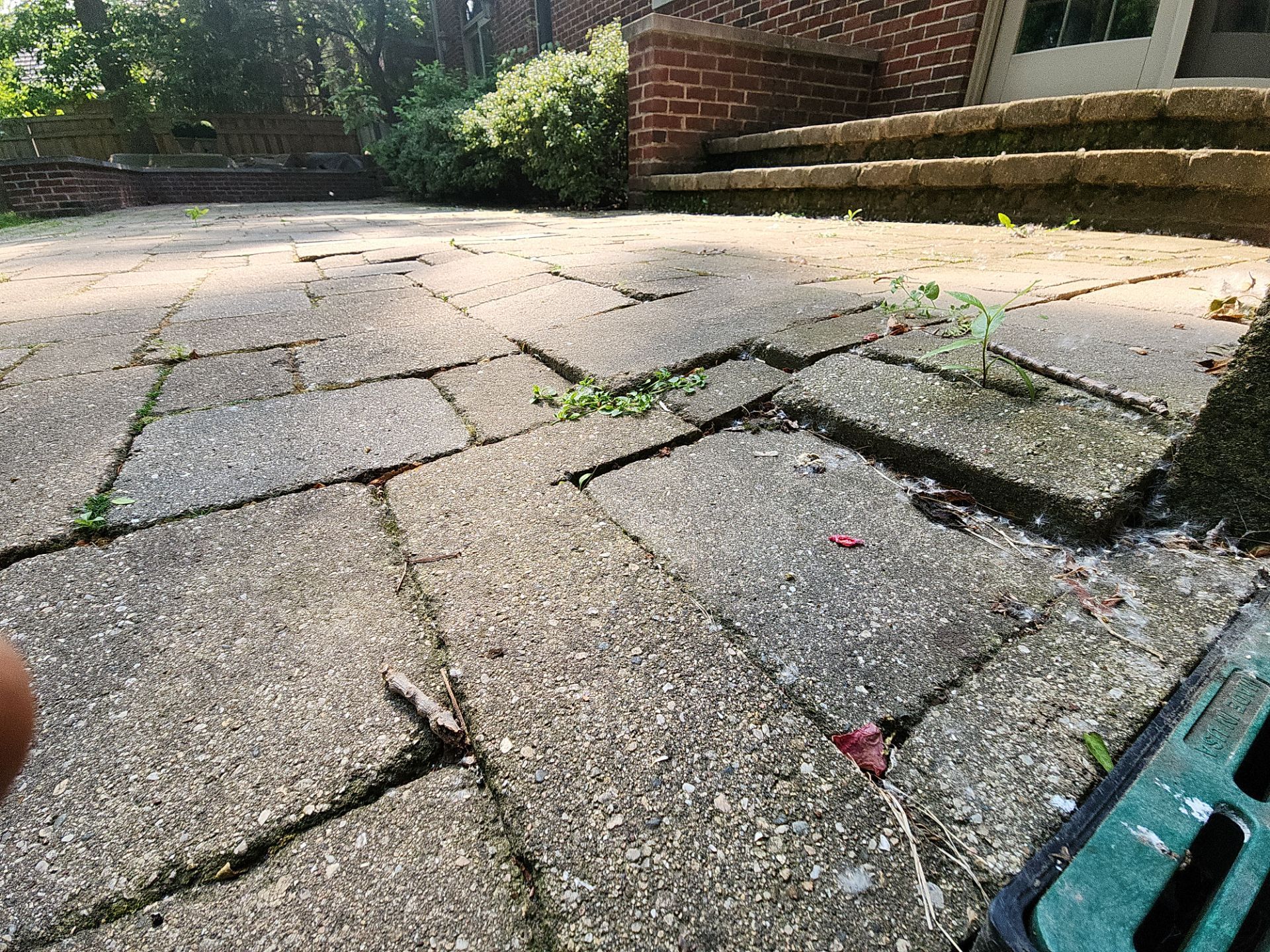Brick paver repair, clean, seal and poly sanding by Northern Power Washing LLC.