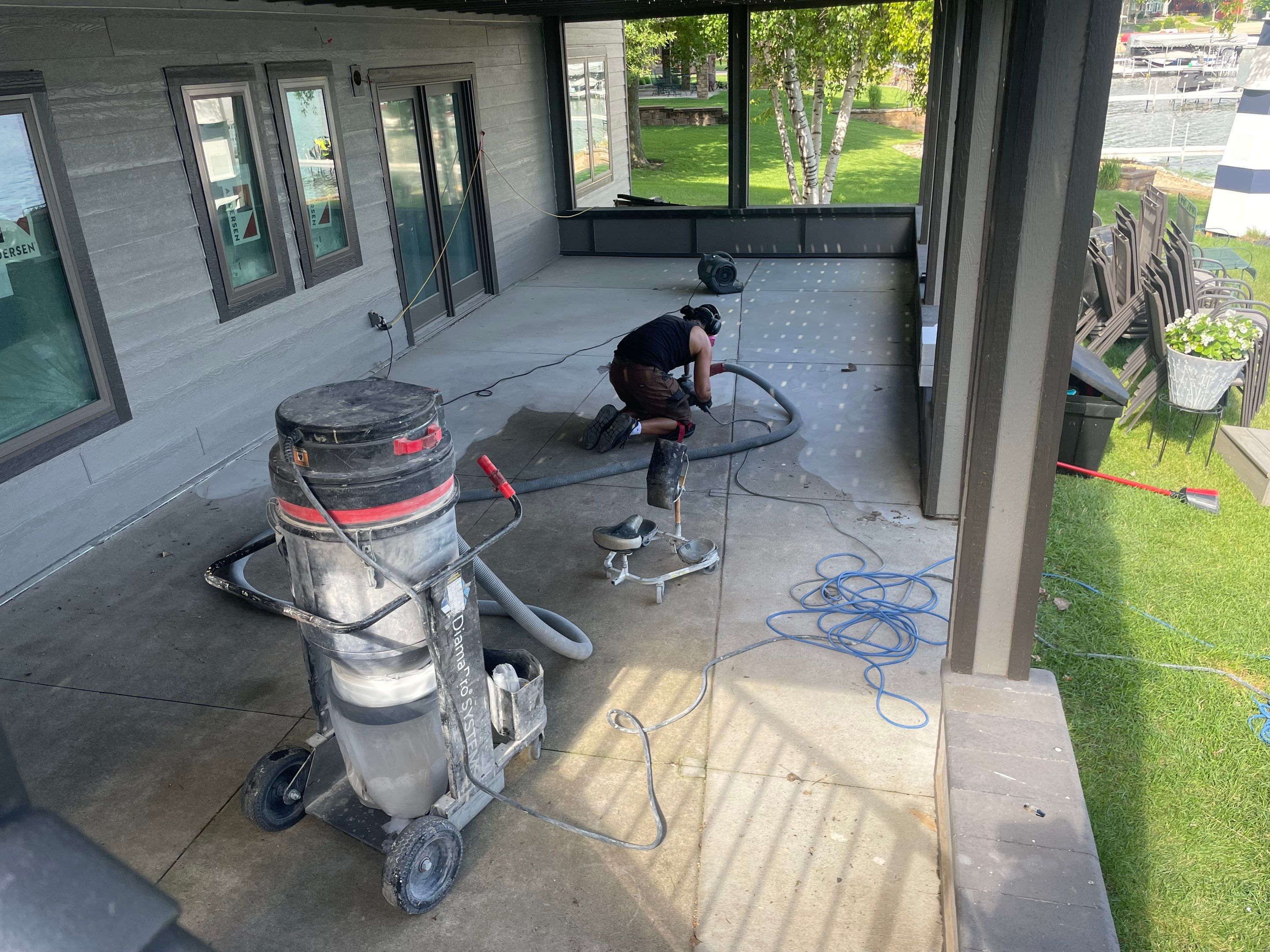 Lakefront Screened Patio Concrete Coating Installation in Wentworth by Select Painting, Coatings & Garage Cabinets