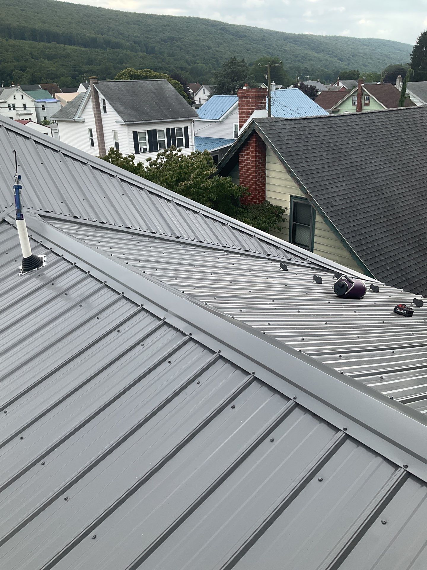 Charcoal Metal Roof & Blue Siding — A Refreshing New Look by Esh Builders