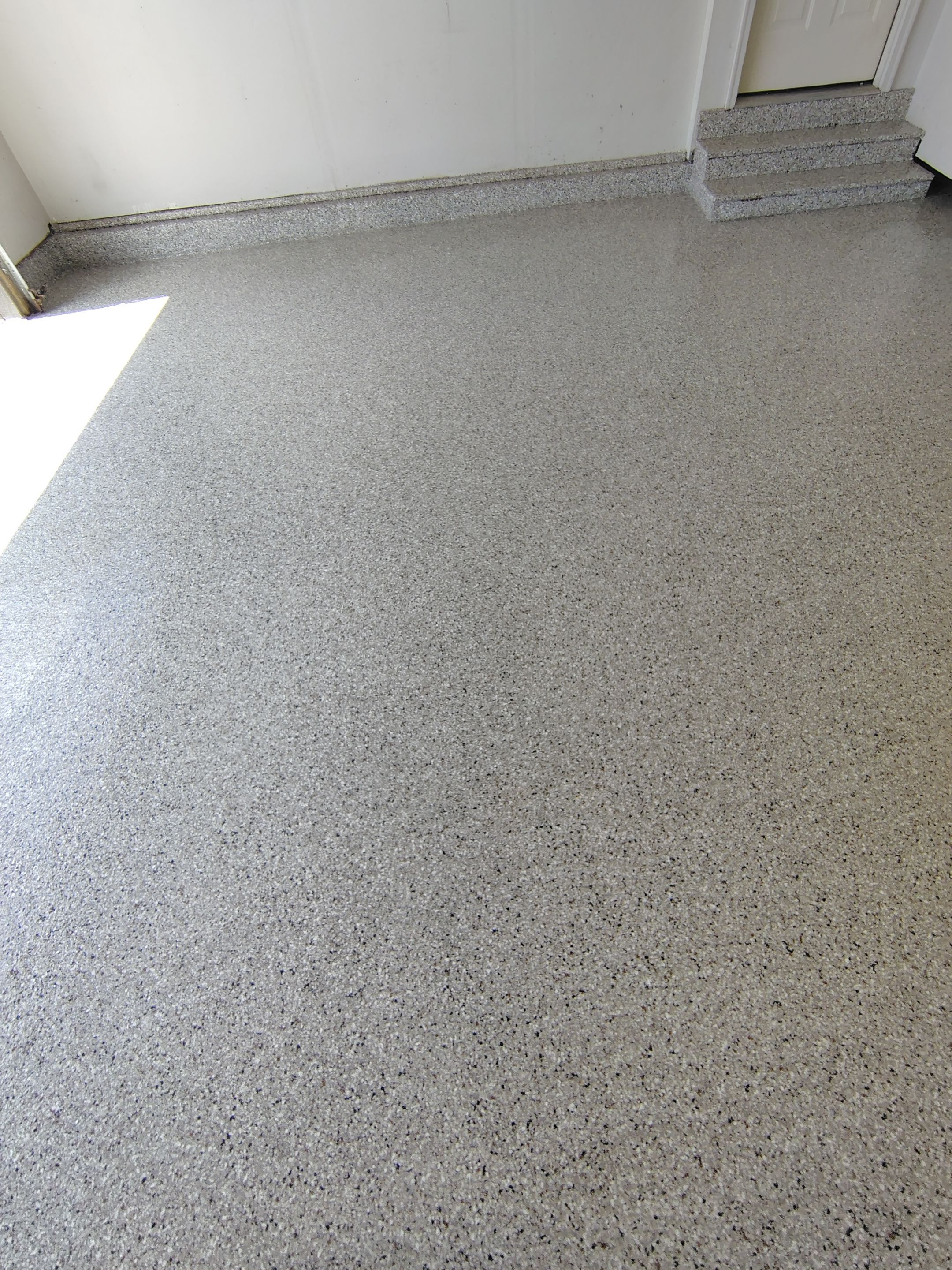 Decorative Chip Epoxy Garage Floor Coating in Sioux Falls by Select Painting, Coatings & Garage Cabinets