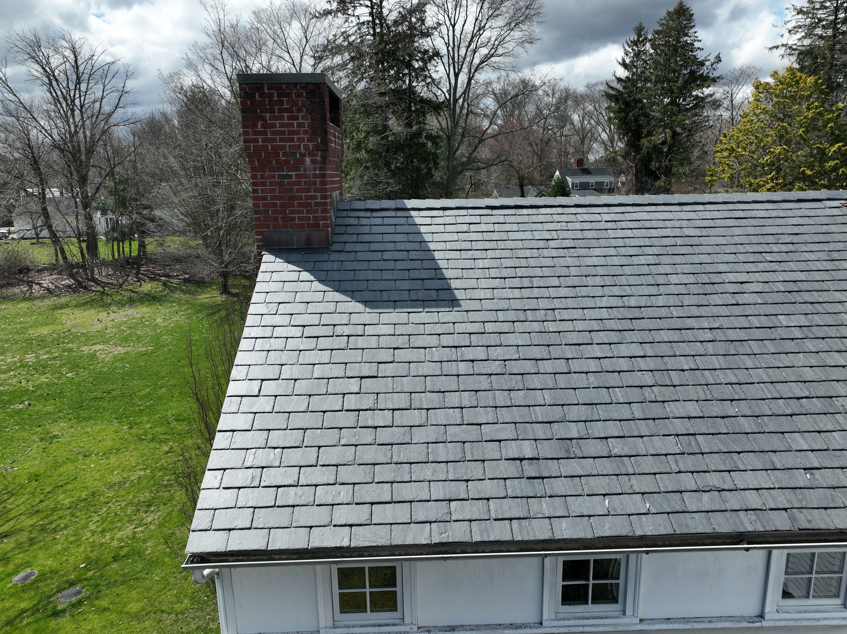 Residential Roofing Installation using Vermont Slate by A Plus Exterior