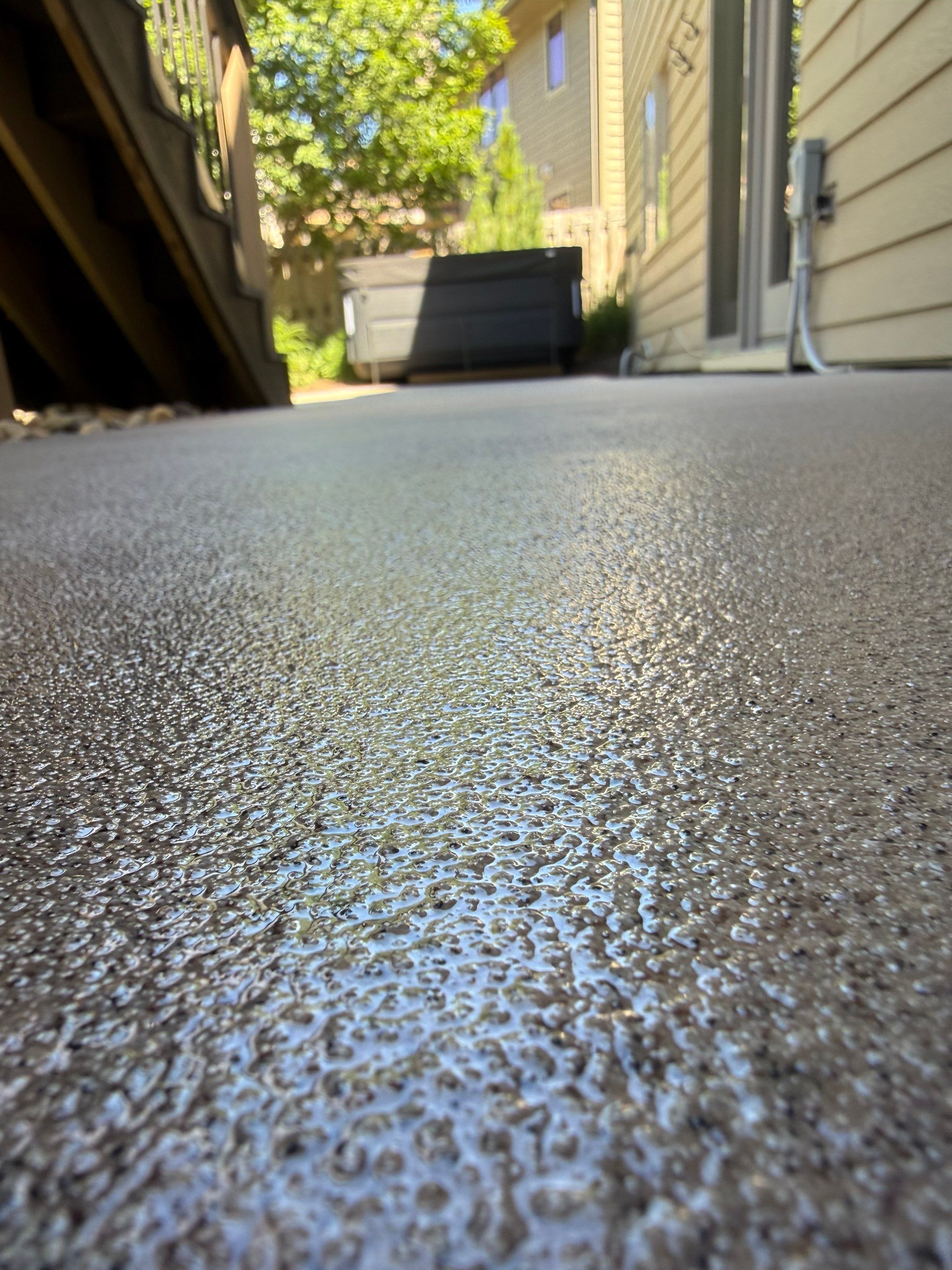Textured Concrete Coating and Paver Patio Refresh in Sioux Falls by Select Painting, Coatings & Garage Cabinets