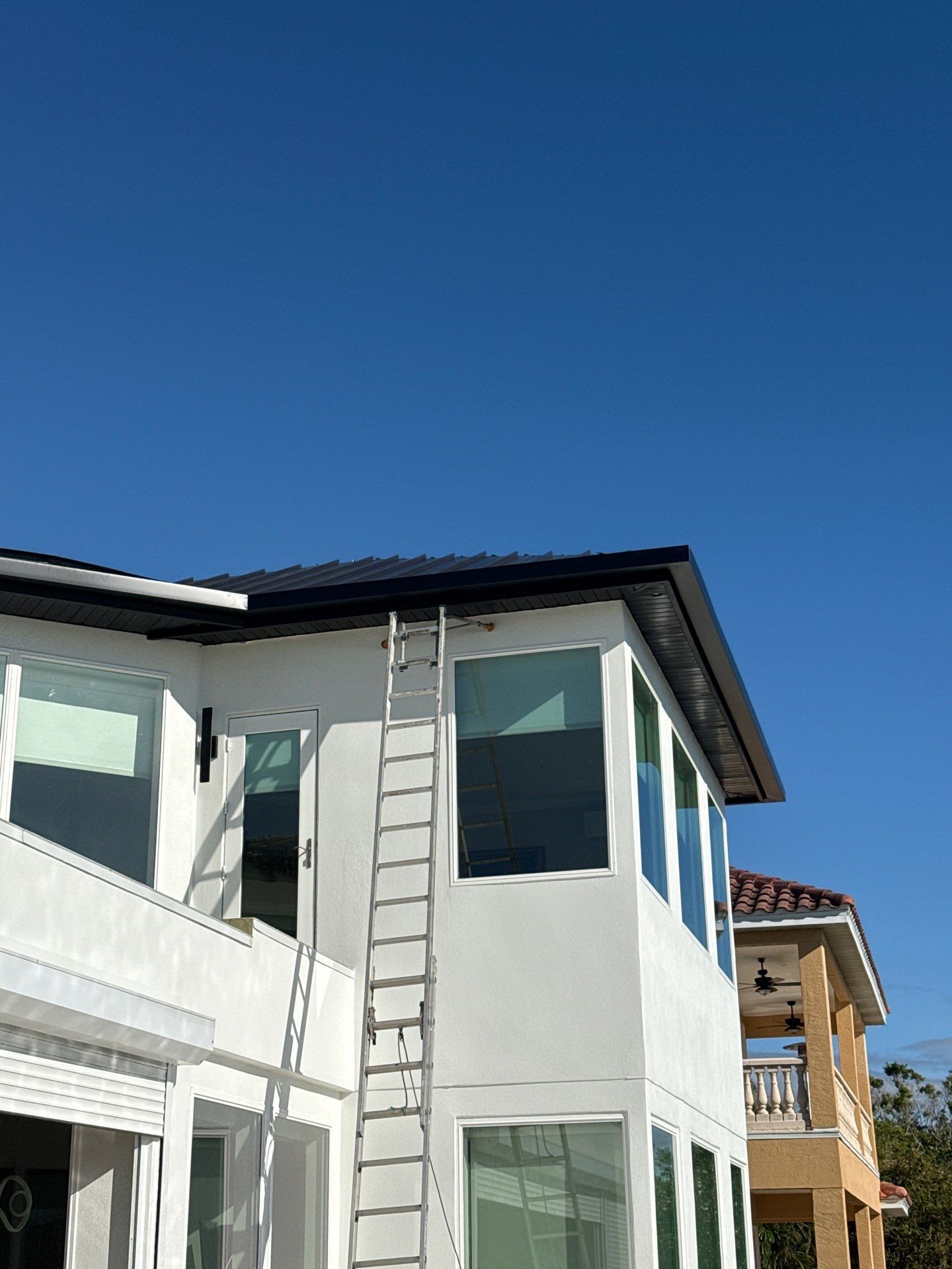 Soffit and Fascia Installation and black seamless gutters in Sarasota FL by Gutter Professors
