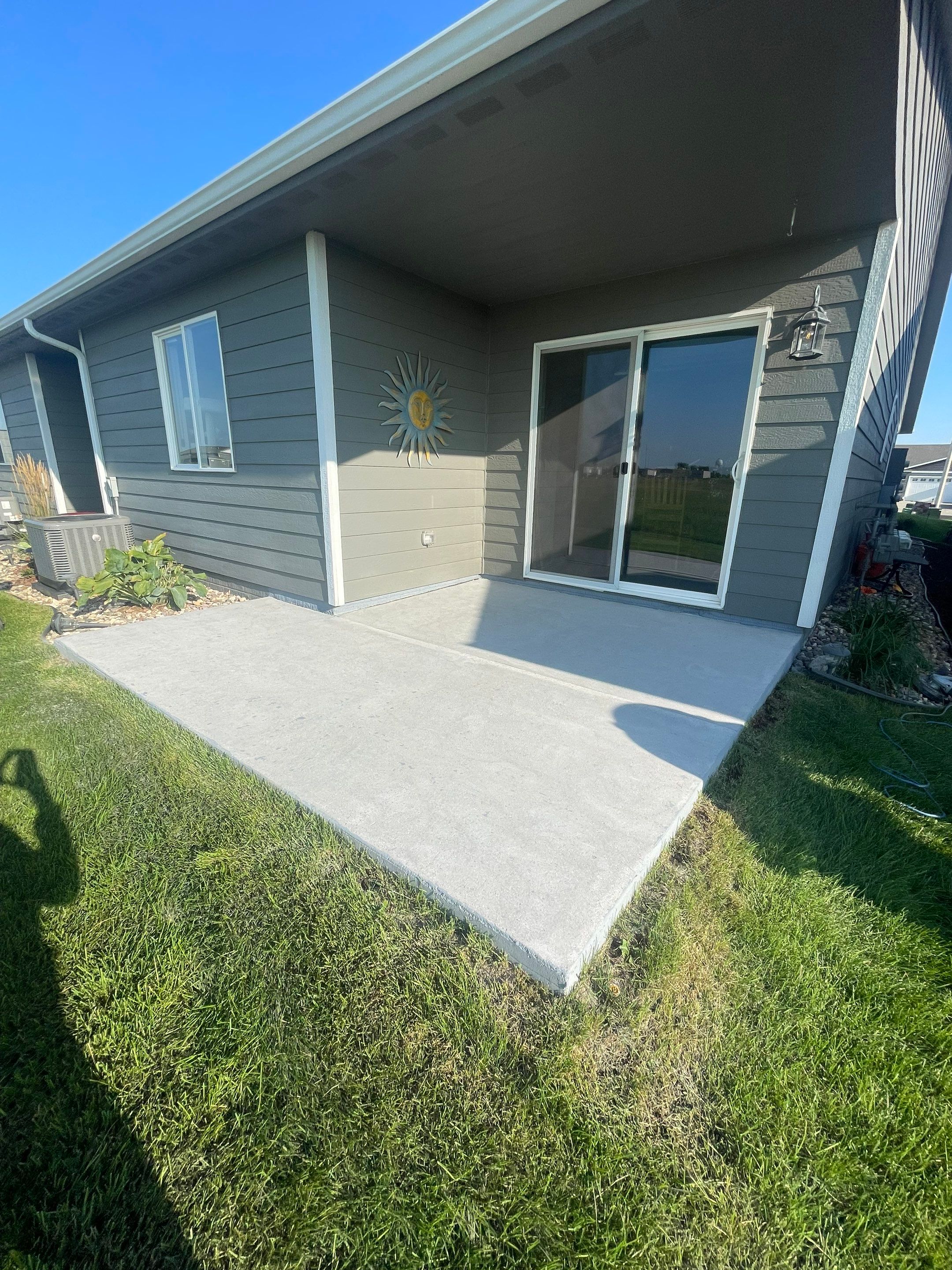Starry Evening Concrete Patio Coating Installation in Tea by Select Painting, Coatings & Garage Cabinets