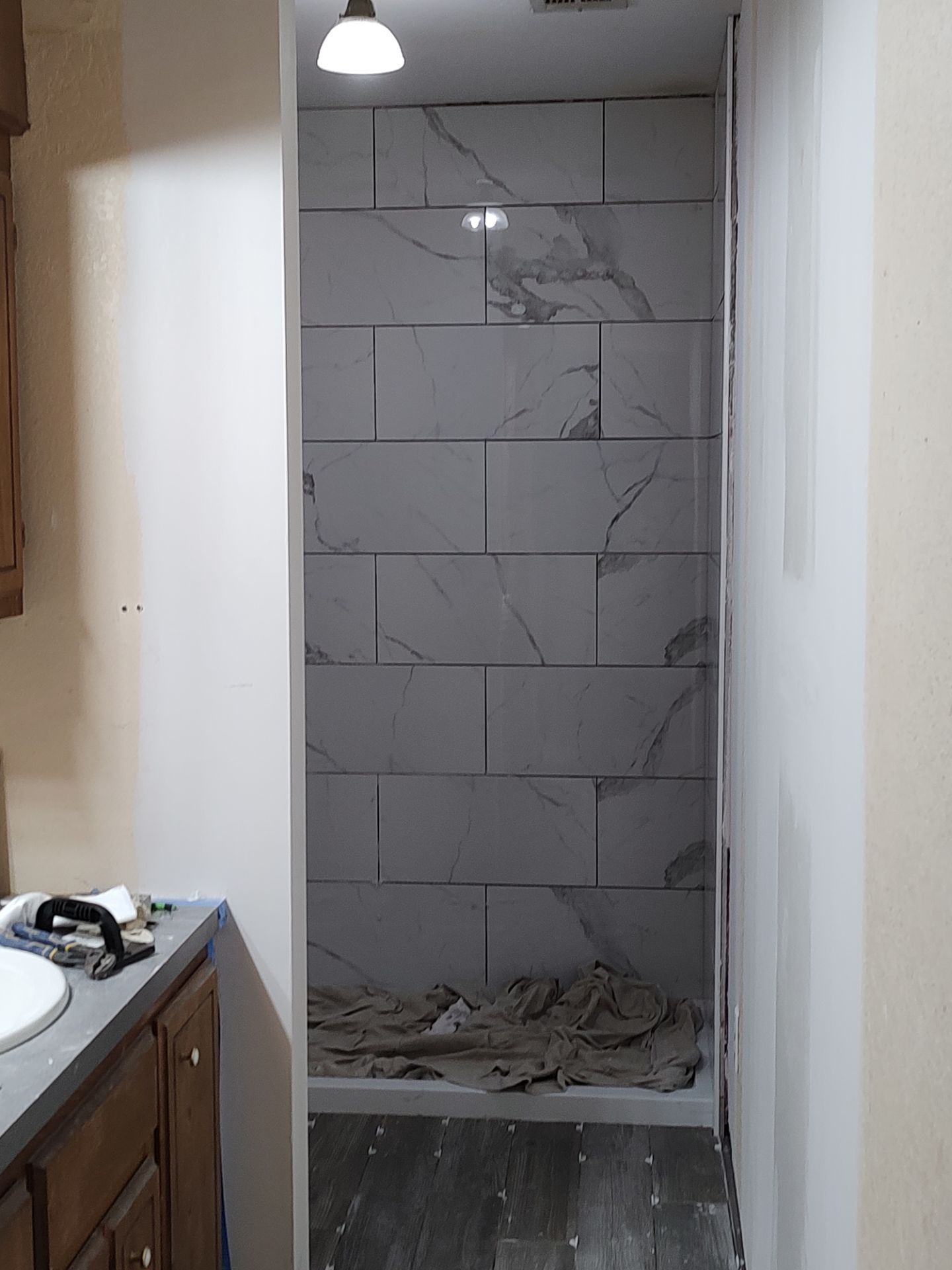 Bathroom remodel w/shower upgrade by In & Out Construction & Remodeling, LLC