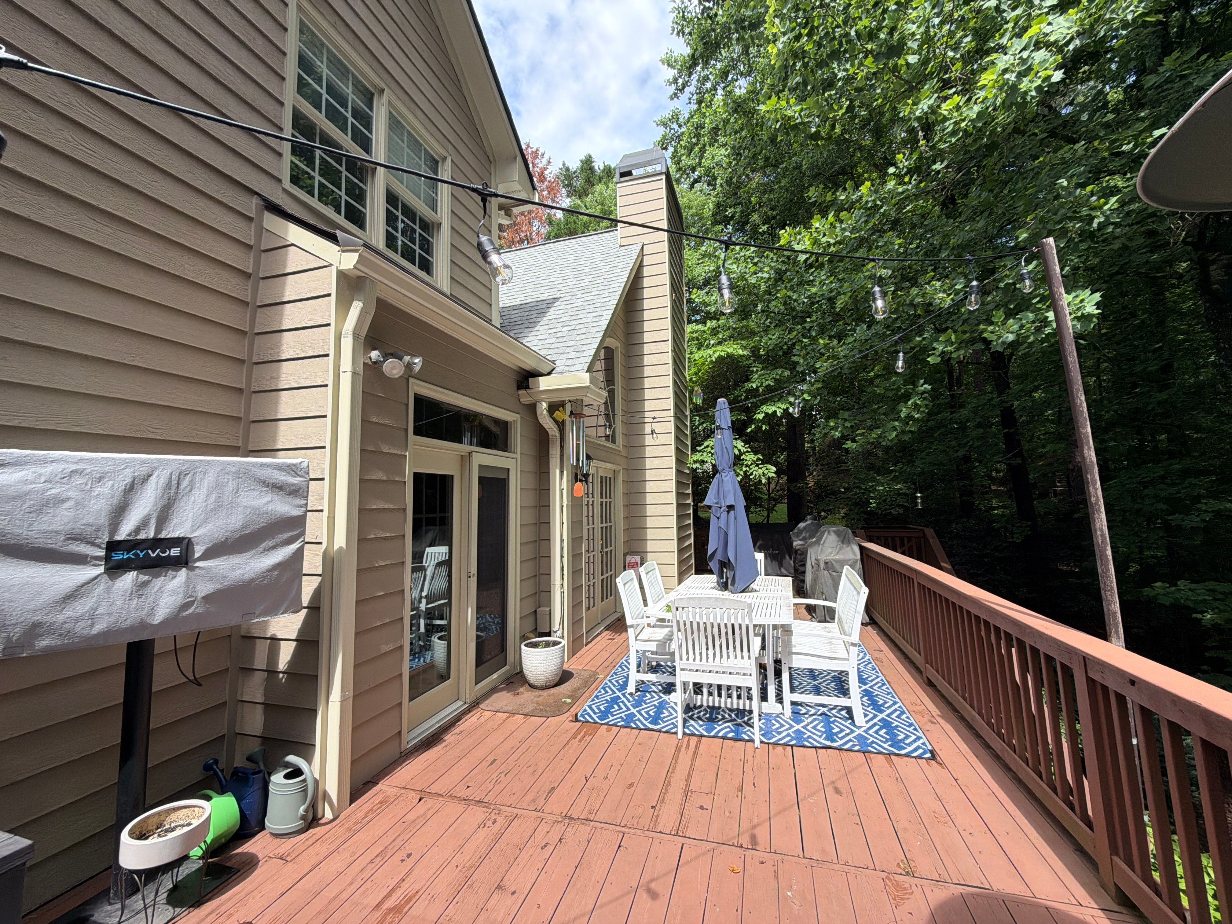 Full James Hardie Siding Replacement and Trex Deck Resurface in the Saddle Color by Nelson Exteriors 