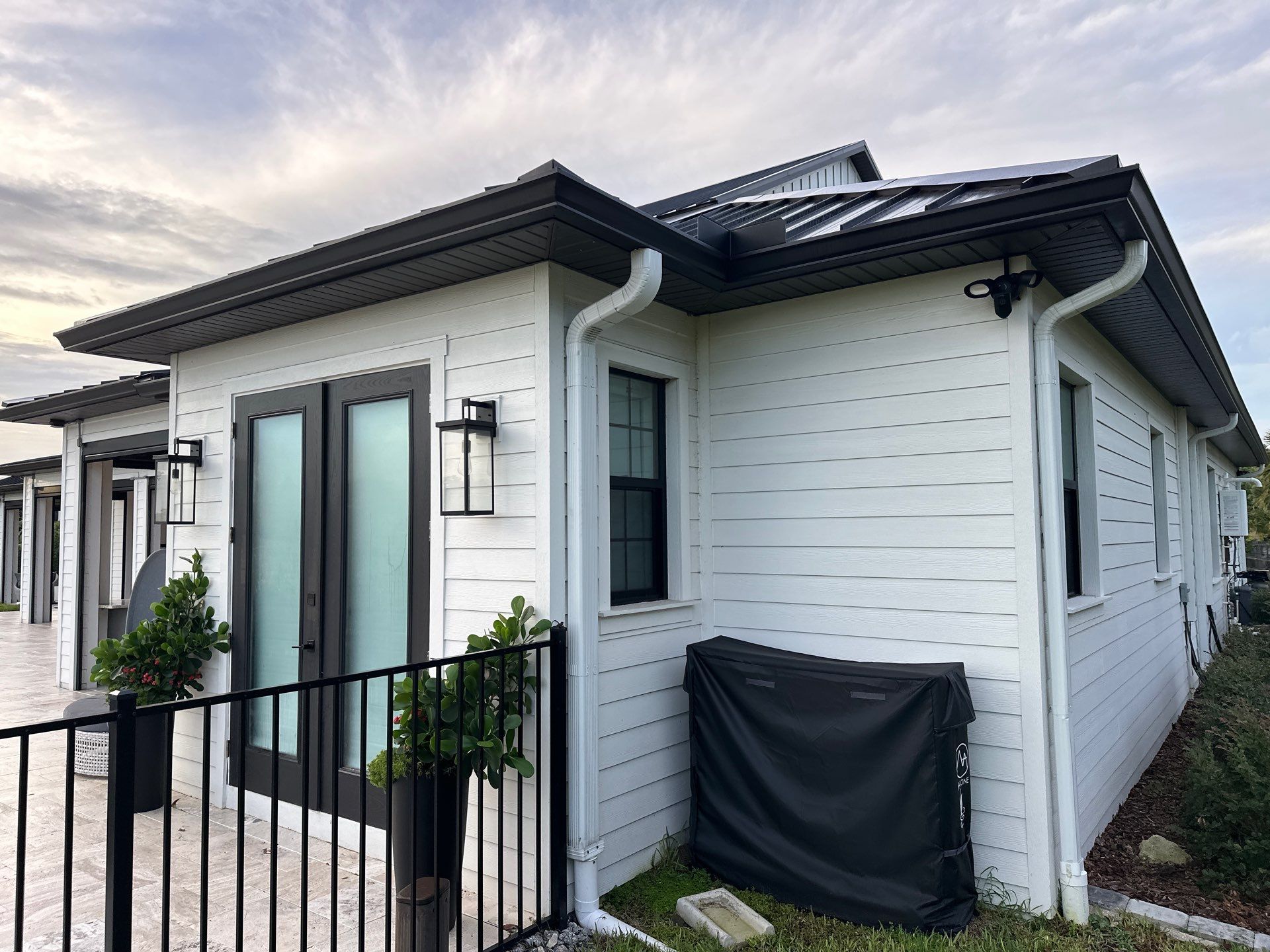 Complete Two-Story House Wash and Driveway Cleaning in Winding River Community, Bradenton, FL by Sunshine AquaWash