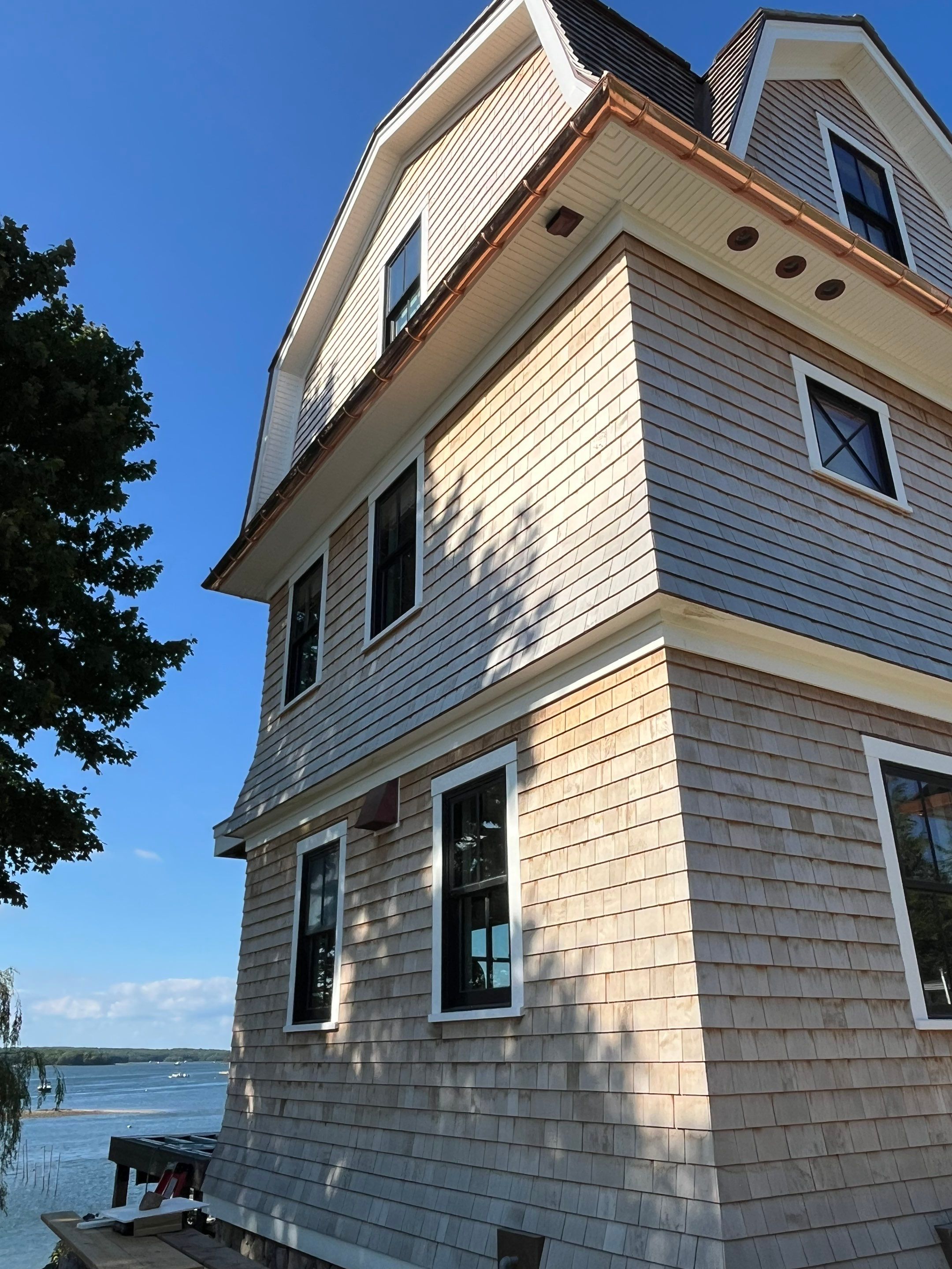 Great Island - Red Cedar Roofing, Yellow Cedar Siding, Standing Seam Copper, & Copper Gutters by Rinaldi Brothers