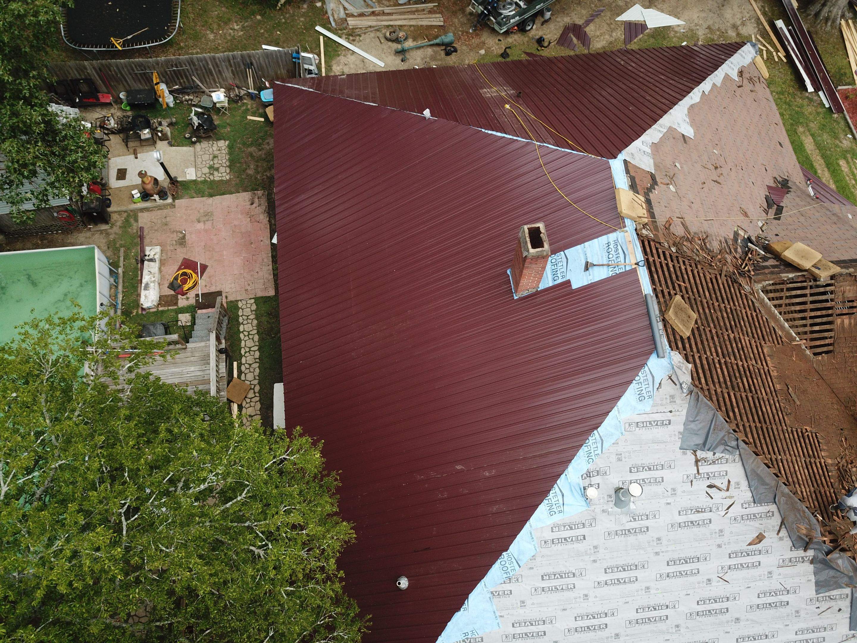 Residential Metal Roof Replacement using Reed's Metals: Colored Residental Panel (Burgundy) by Hostetler Roofing