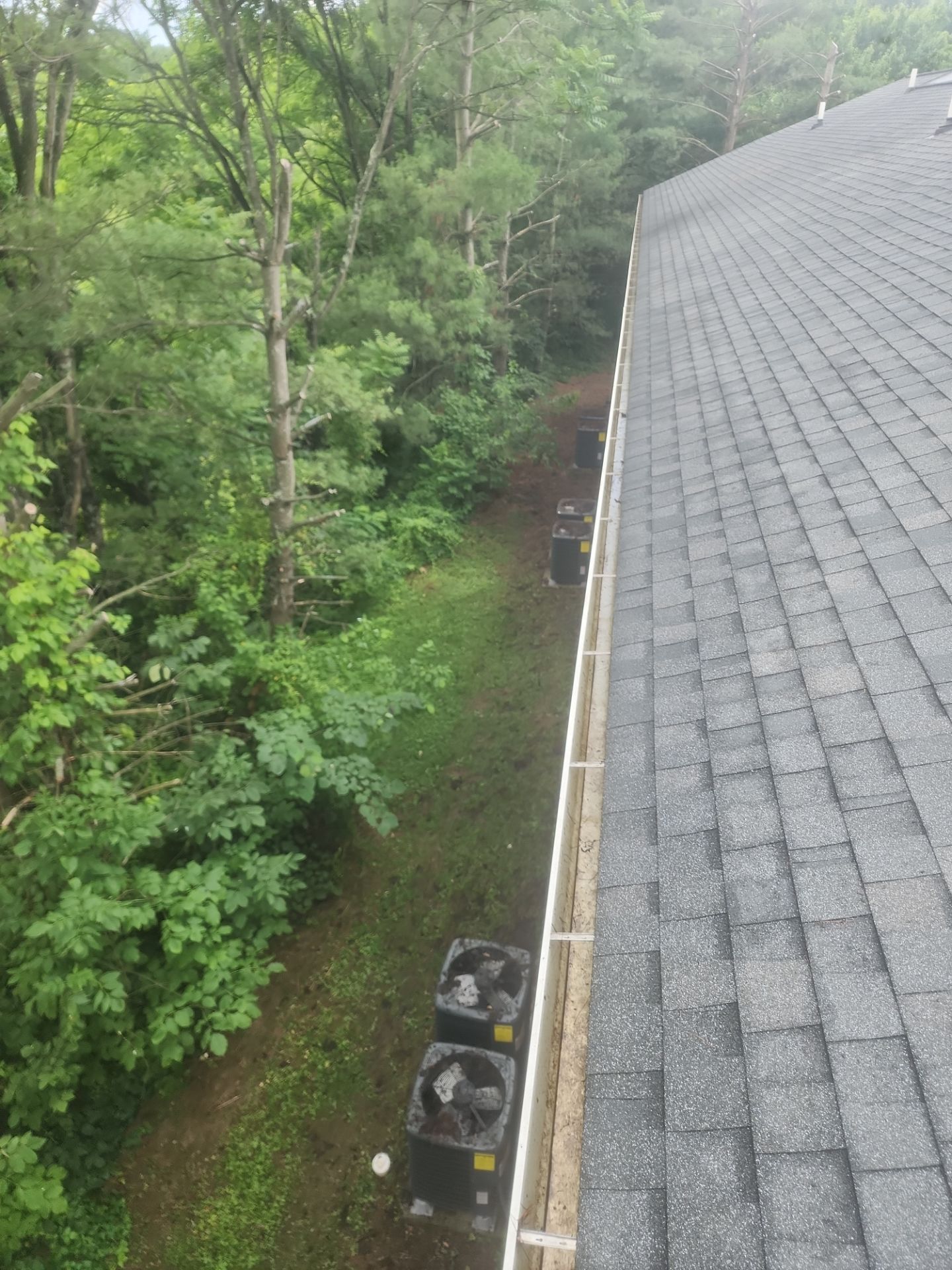HOA gutter cleaning in Hagerstown, MD, after  photo showing full gutters.