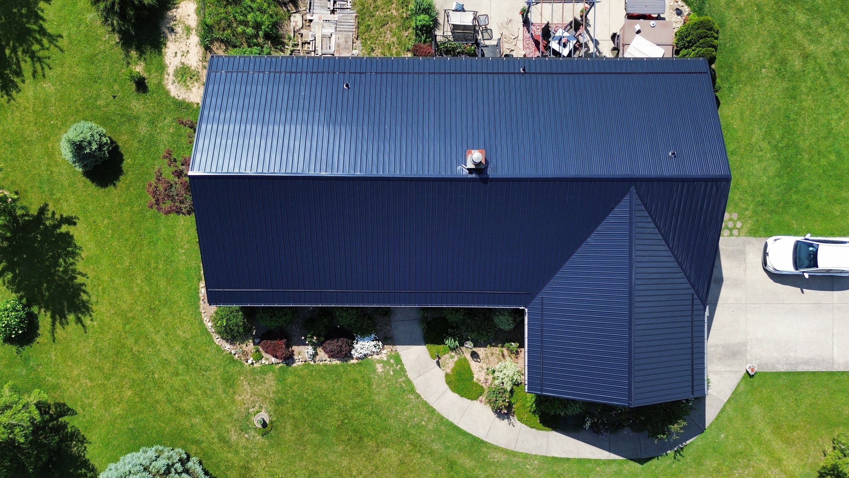 Residential Roofing Installation using Perfromance Panel Metal - Black by RoofX 