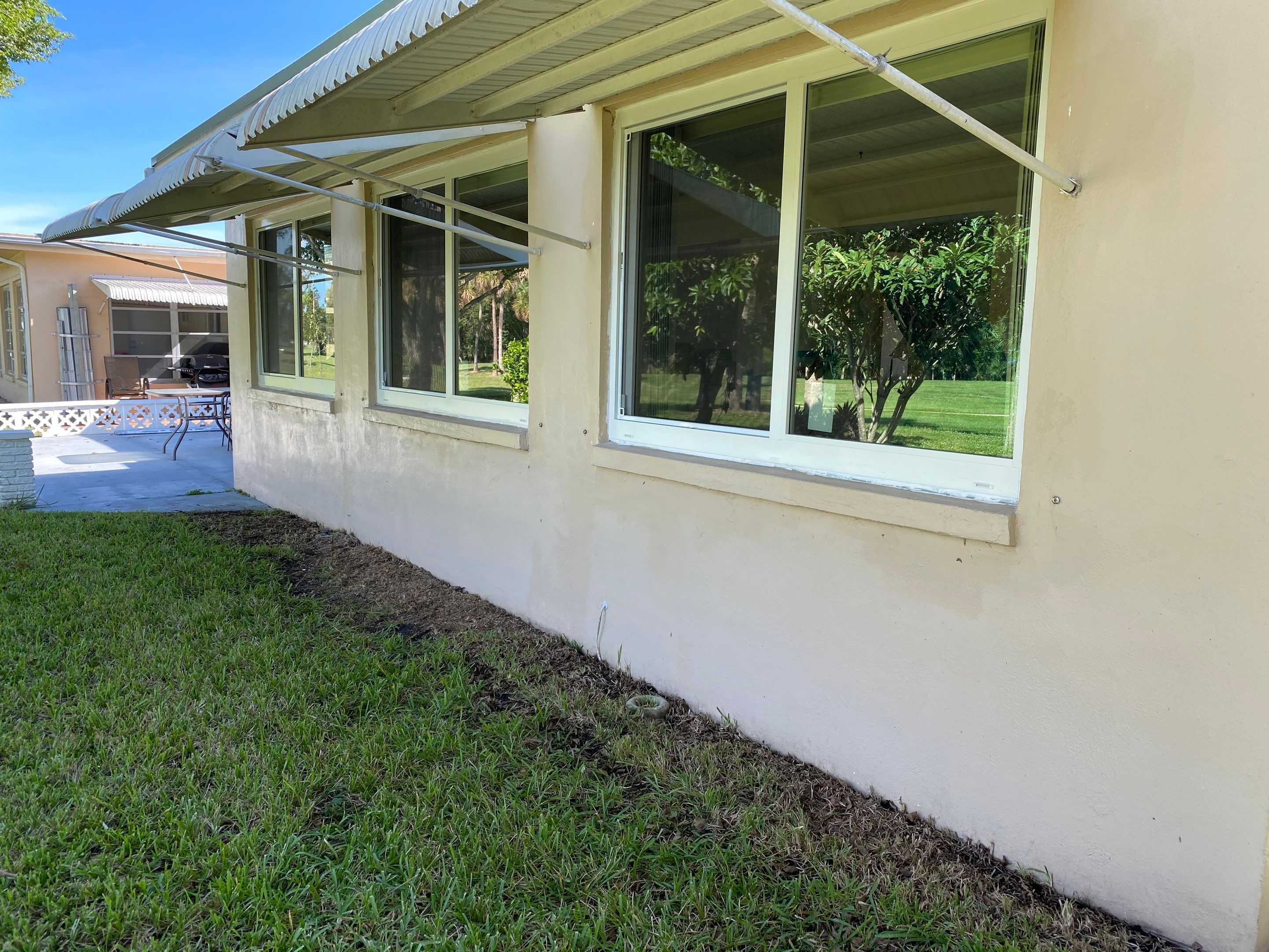 Tamarac Residential Entry Door and Aluminum Window Installation Project by The Door Doctor of South Florida, Inc.