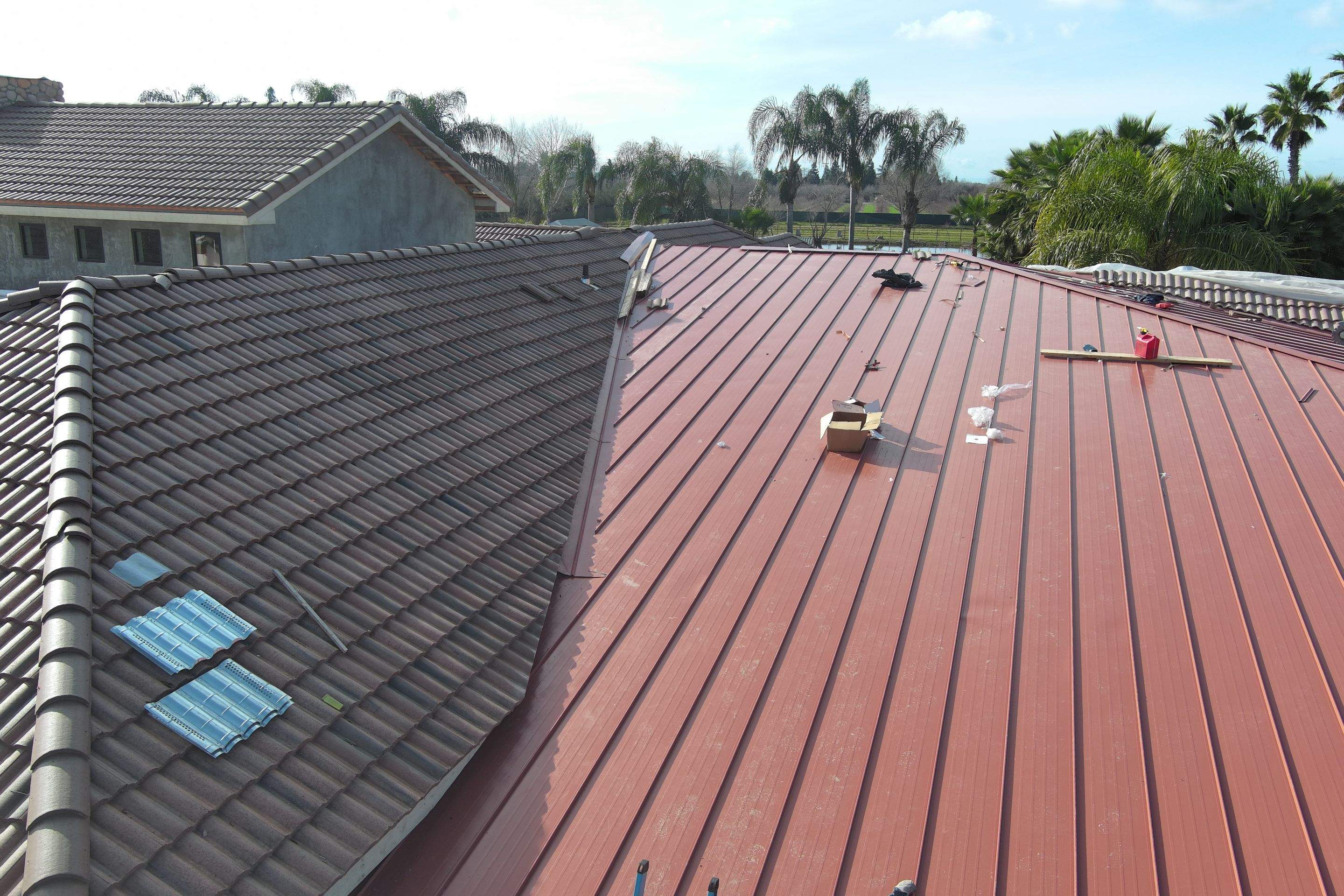 Tile, Metal, and TPO roofing project (new construction) by Straight Edge Roofing Inc