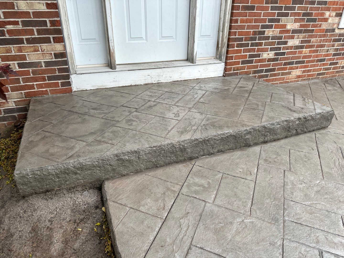 Ashlar slate stamped concrete patio  by NG Masonry & Construction LLC