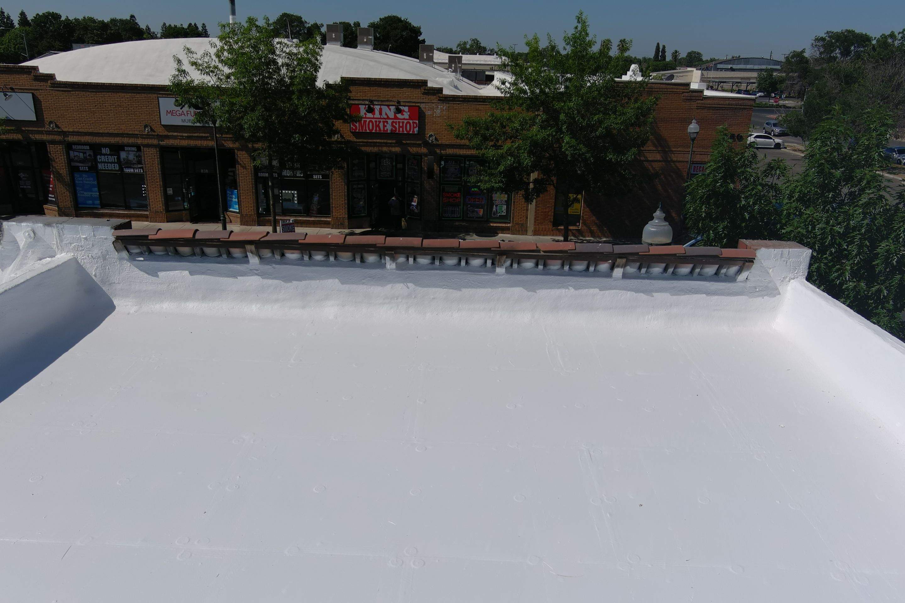 Commercial Roofing Installation using Conklin BenchPly system with PUMA top coat (imbedded fabric system) by Straight Edge Roofing Inc