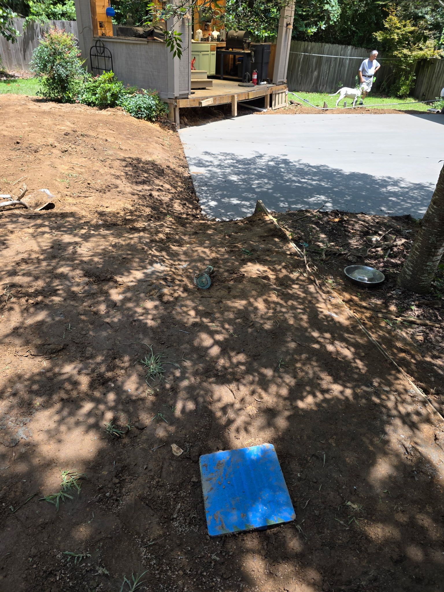 Patio in concrete with drainage improvements by Cornerstone Home Builders, LLC