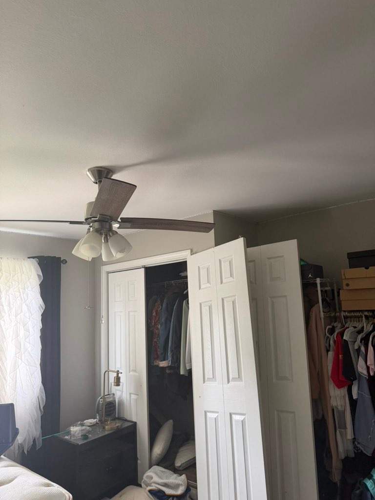 White Paneled Bifold Closet Door Installation by Legendary Services Company LLC.