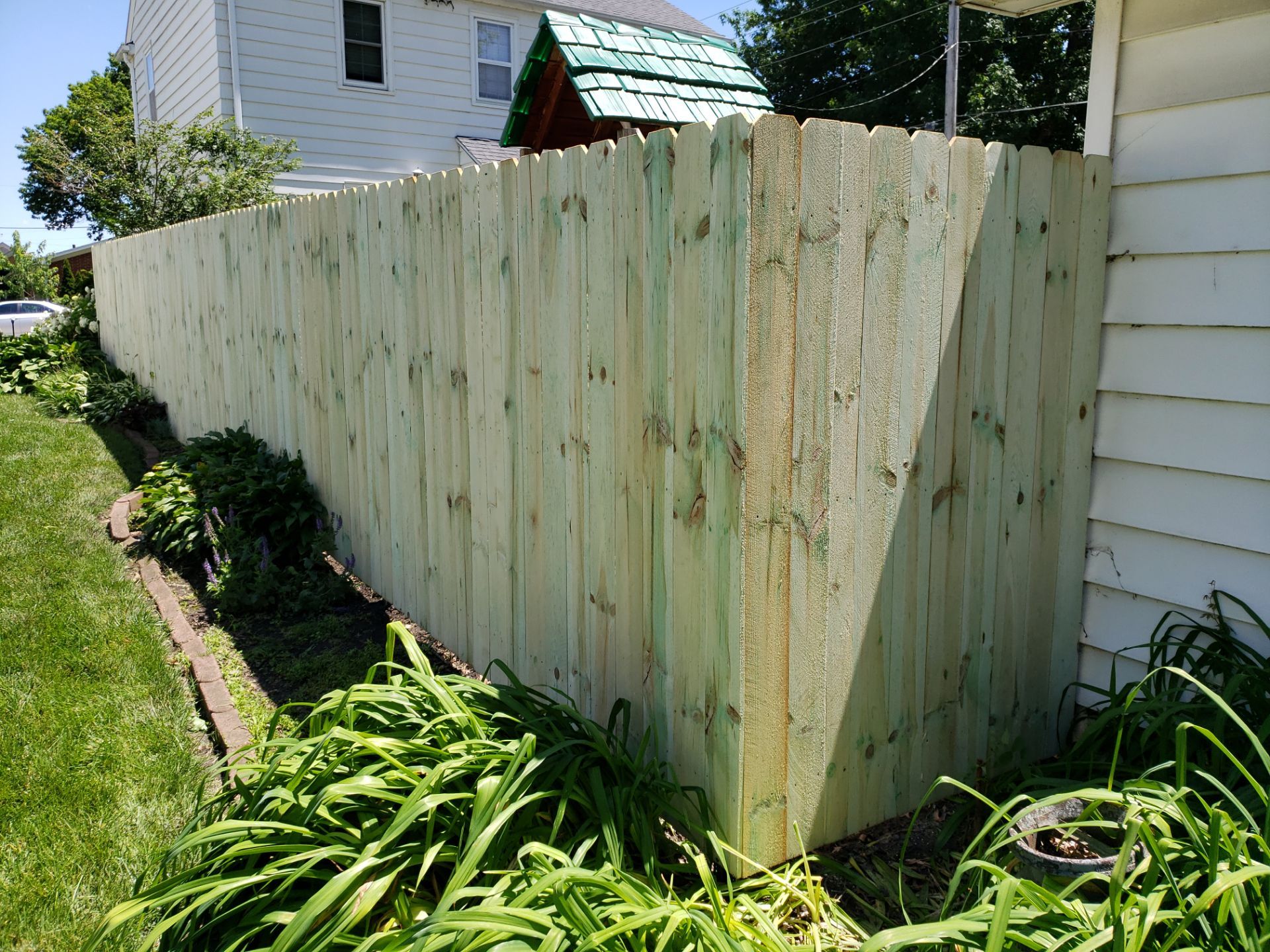 Pressure-Treated Pine Privacy Fence Replacement in Waterloo, Iowa by Perfect Picket Fence and Stain
