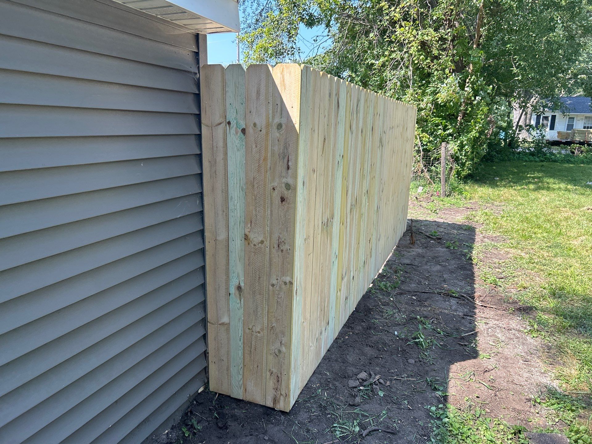 Treated Pine Privacy and Picket Fence Installation in Evansdale by Perfect Picket Fence and Stain