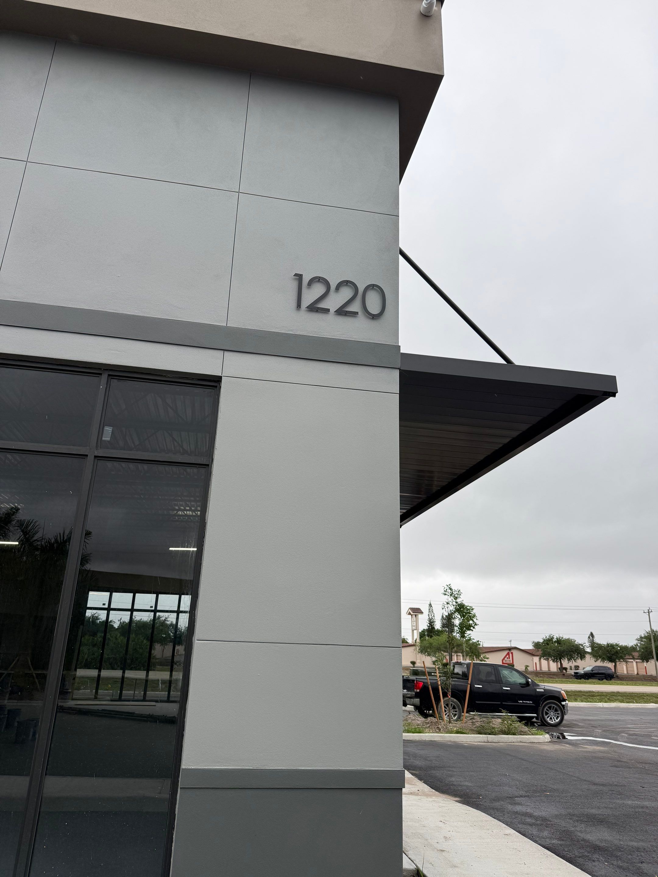 Downspout Installation using collector head in Cape Coral FL by Gutter Professors