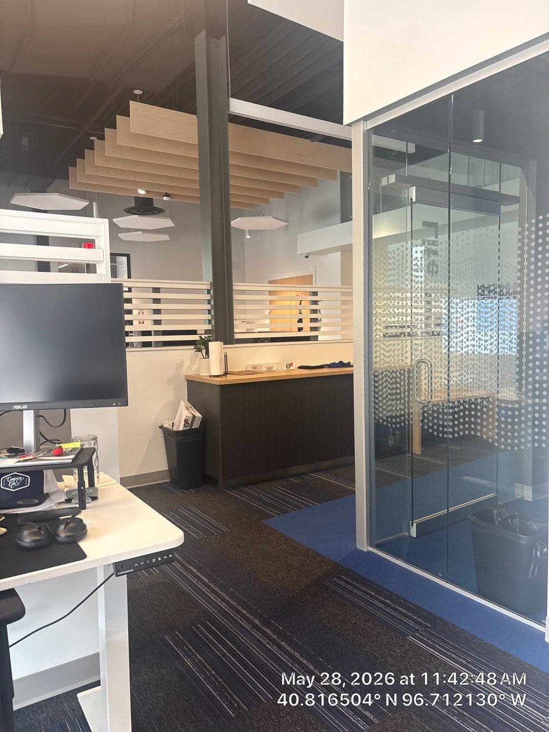 Modern Office Remodel with Acoustic Baffles and Glass Partitions by CompanyCam Sales Demo